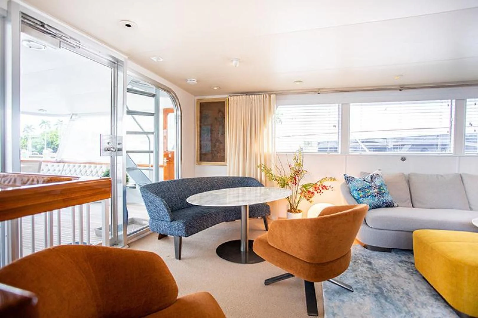 a living room with a couch and a table aboard SOVEREIGN Yacht for Charter