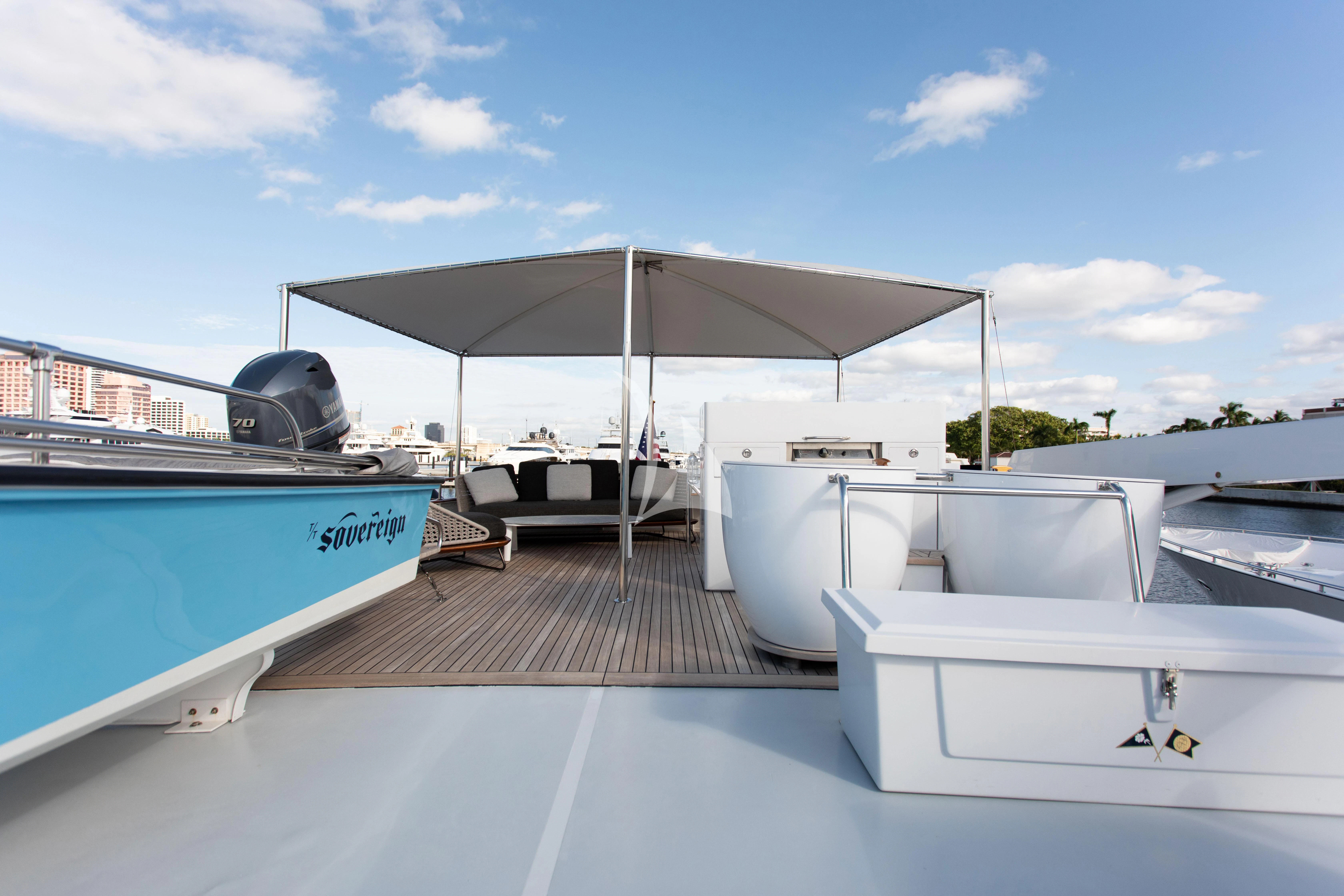a boat dock with a covered patio aboard SOVEREIGN Yacht for Charter