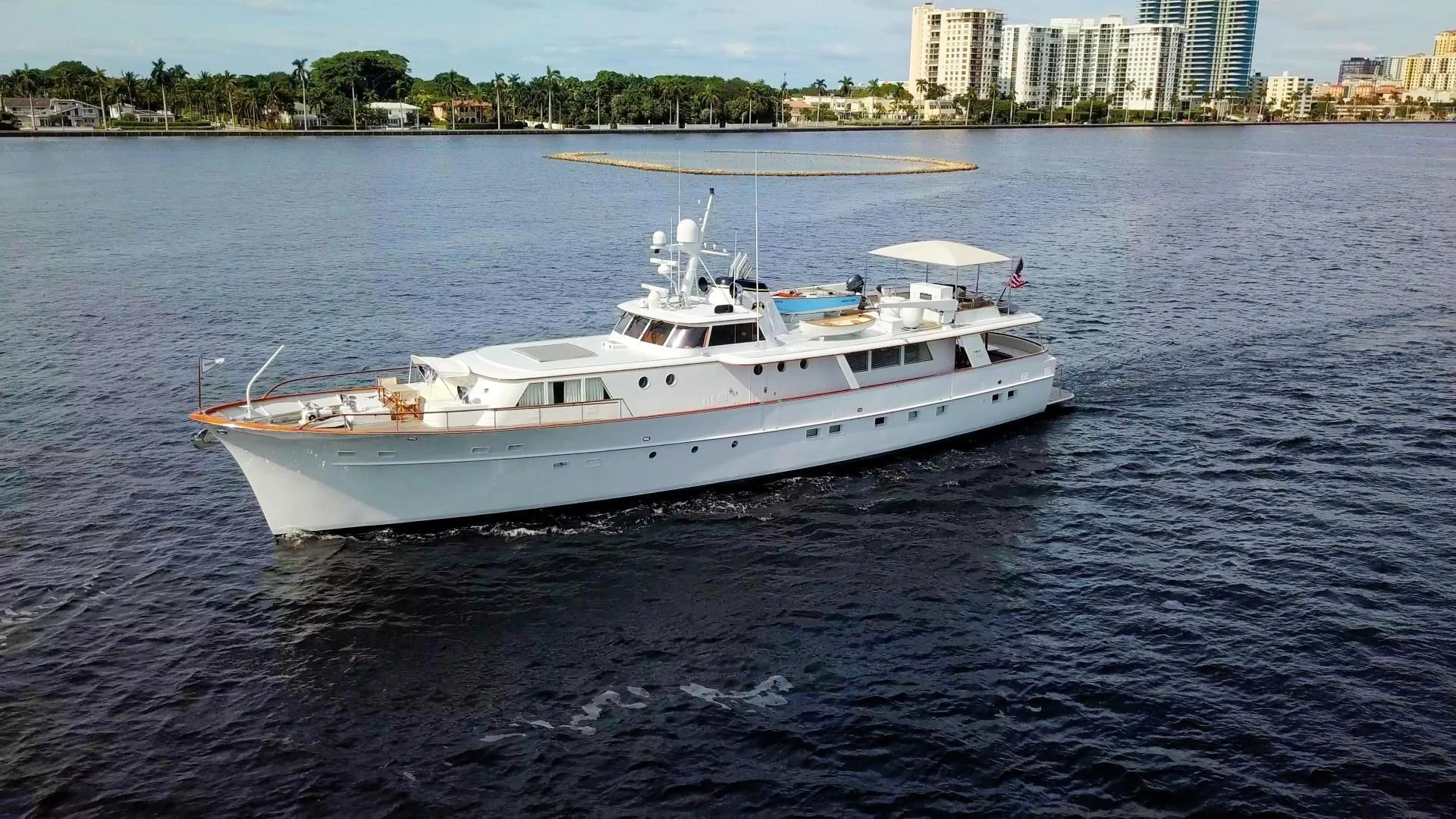a white boat on the water aboard SOVEREIGN Yacht for Charter