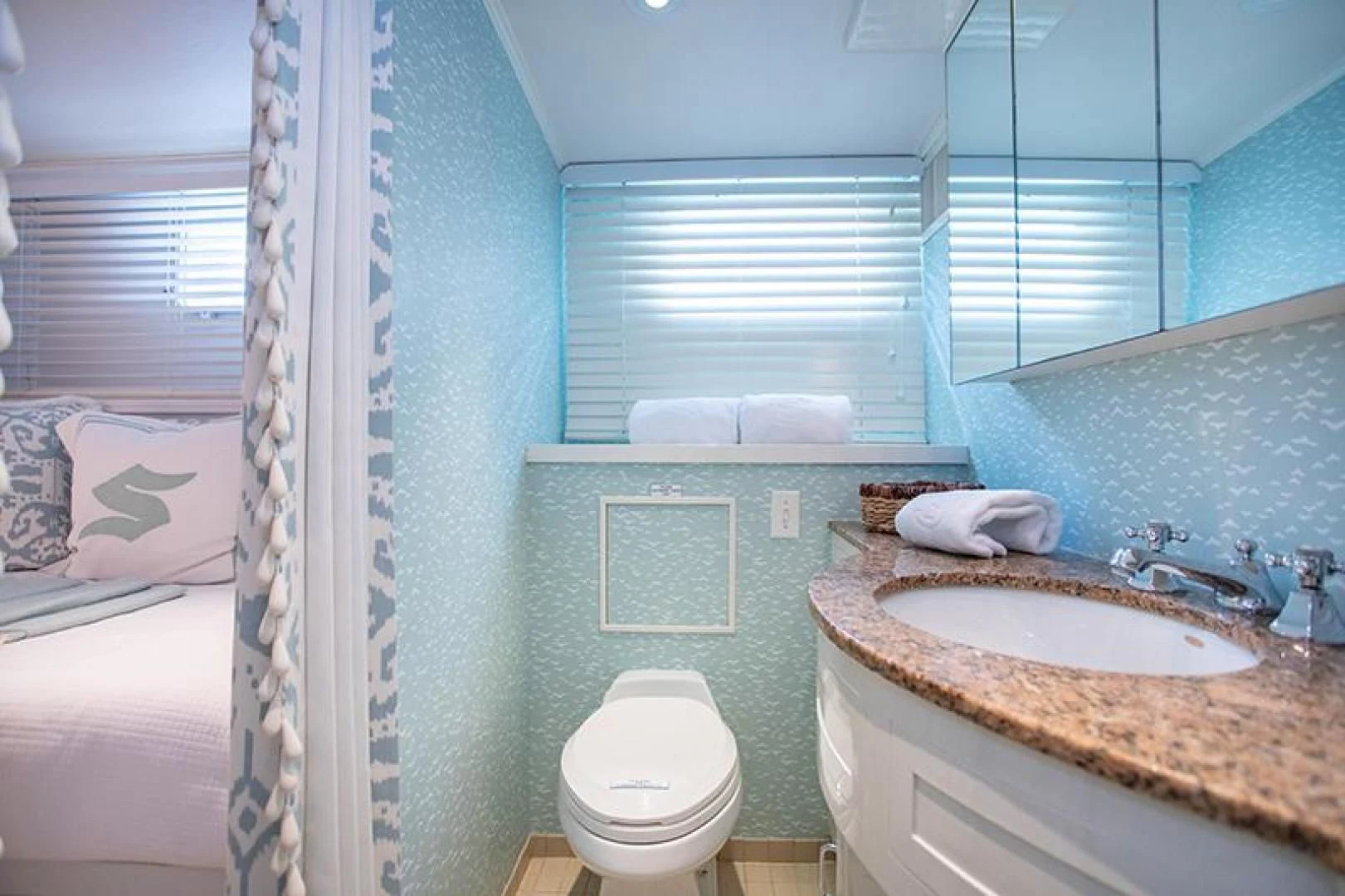 a bathroom with a sink toilet and bathtub aboard SOVEREIGN Yacht for Charter