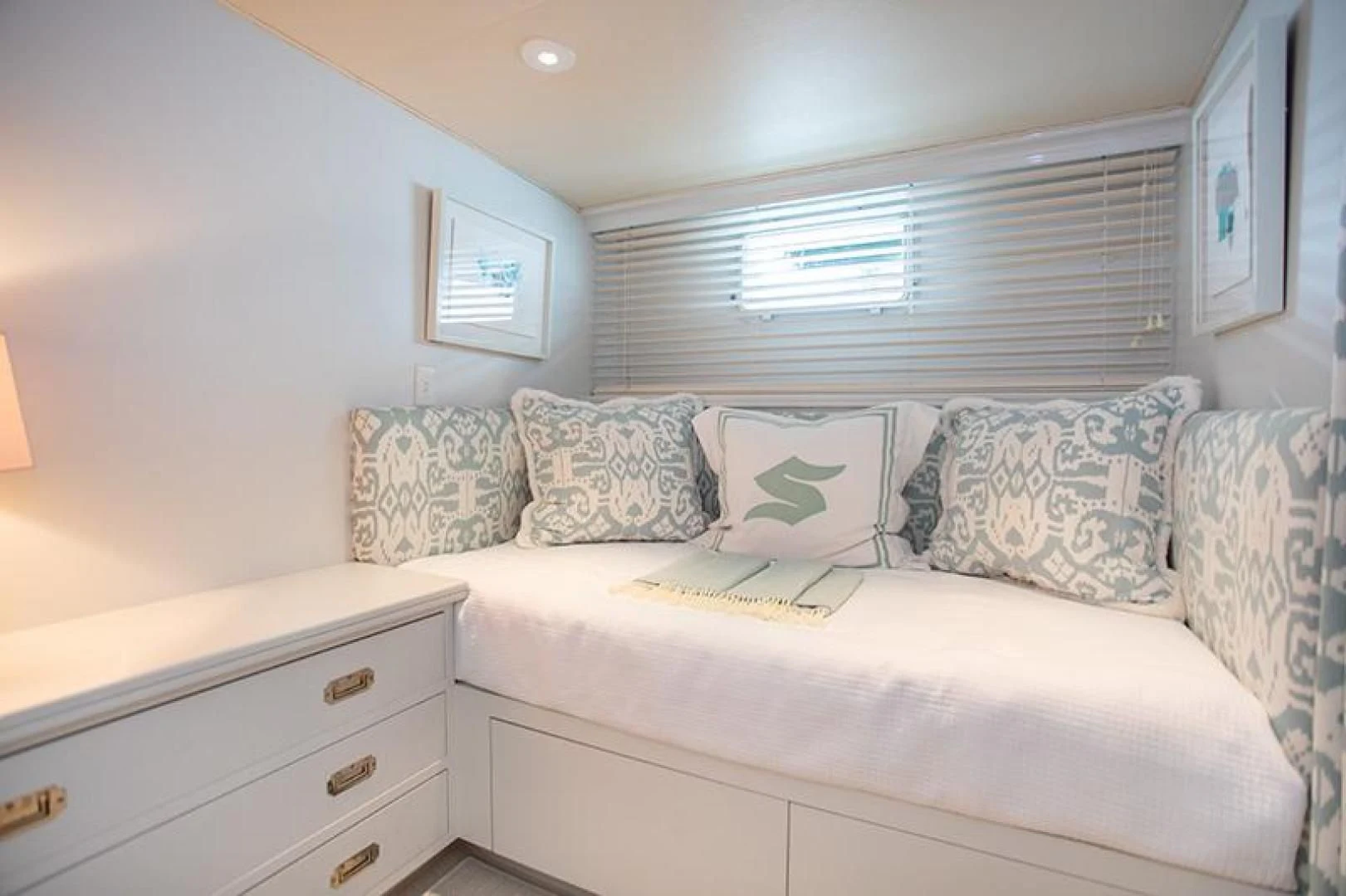 a white couch with pillows aboard SOVEREIGN Yacht for Charter