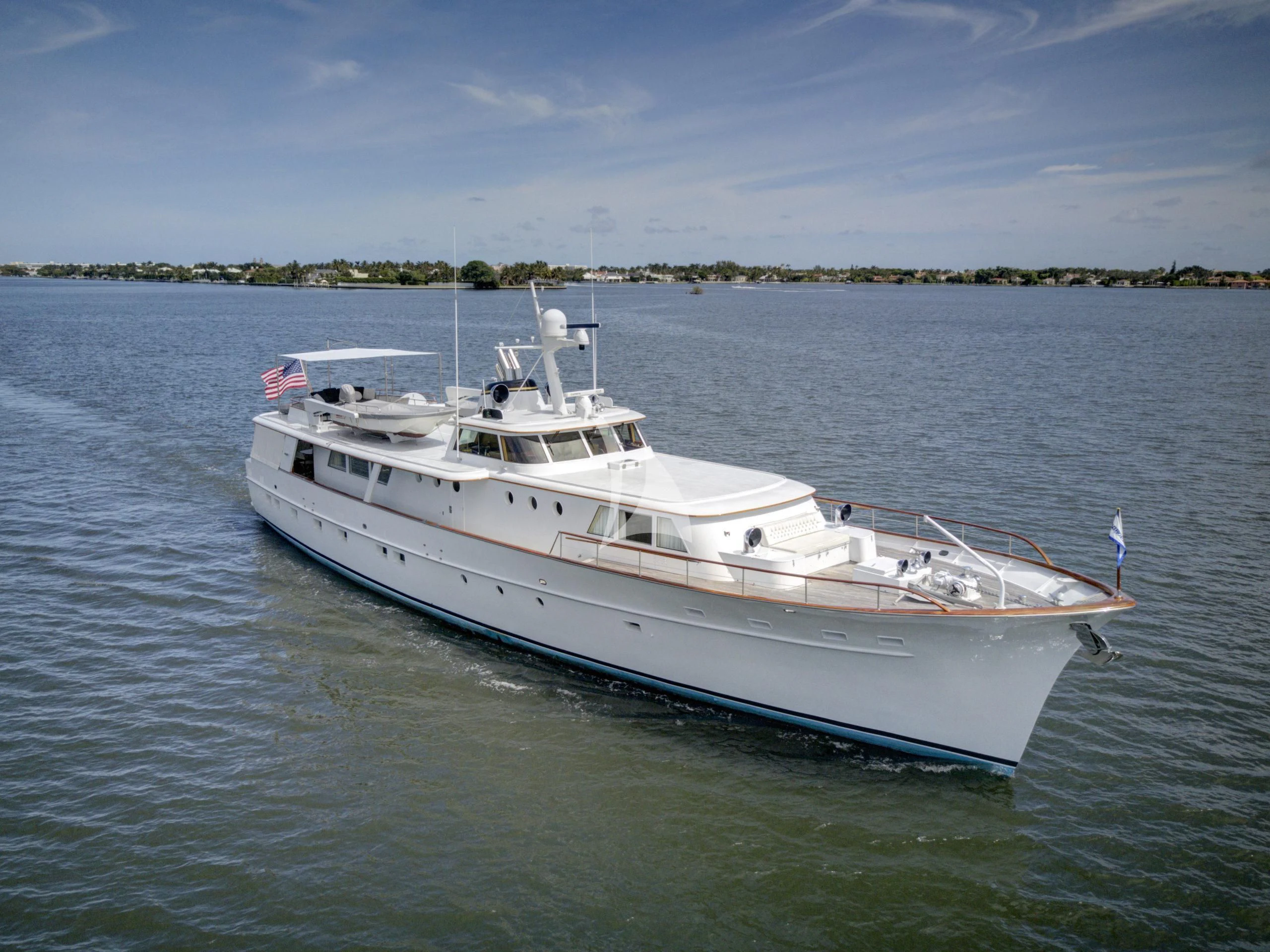 a white boat in the water aboard SOVEREIGN Yacht for Charter