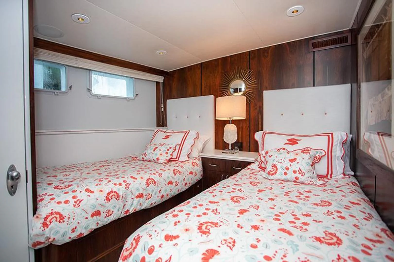a couple of beds in a hotel room aboard SOVEREIGN Yacht for Charter