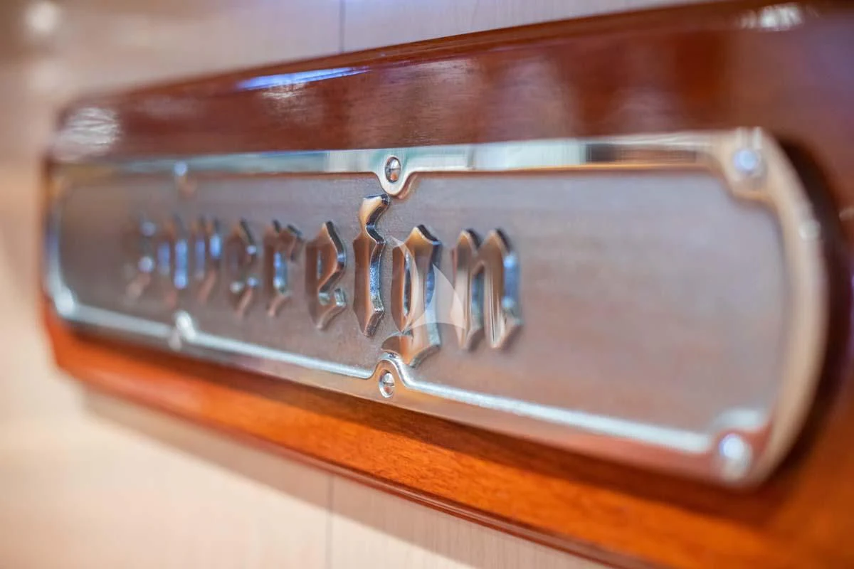 a close-up of a pocket watch aboard SOVEREIGN Yacht for Charter