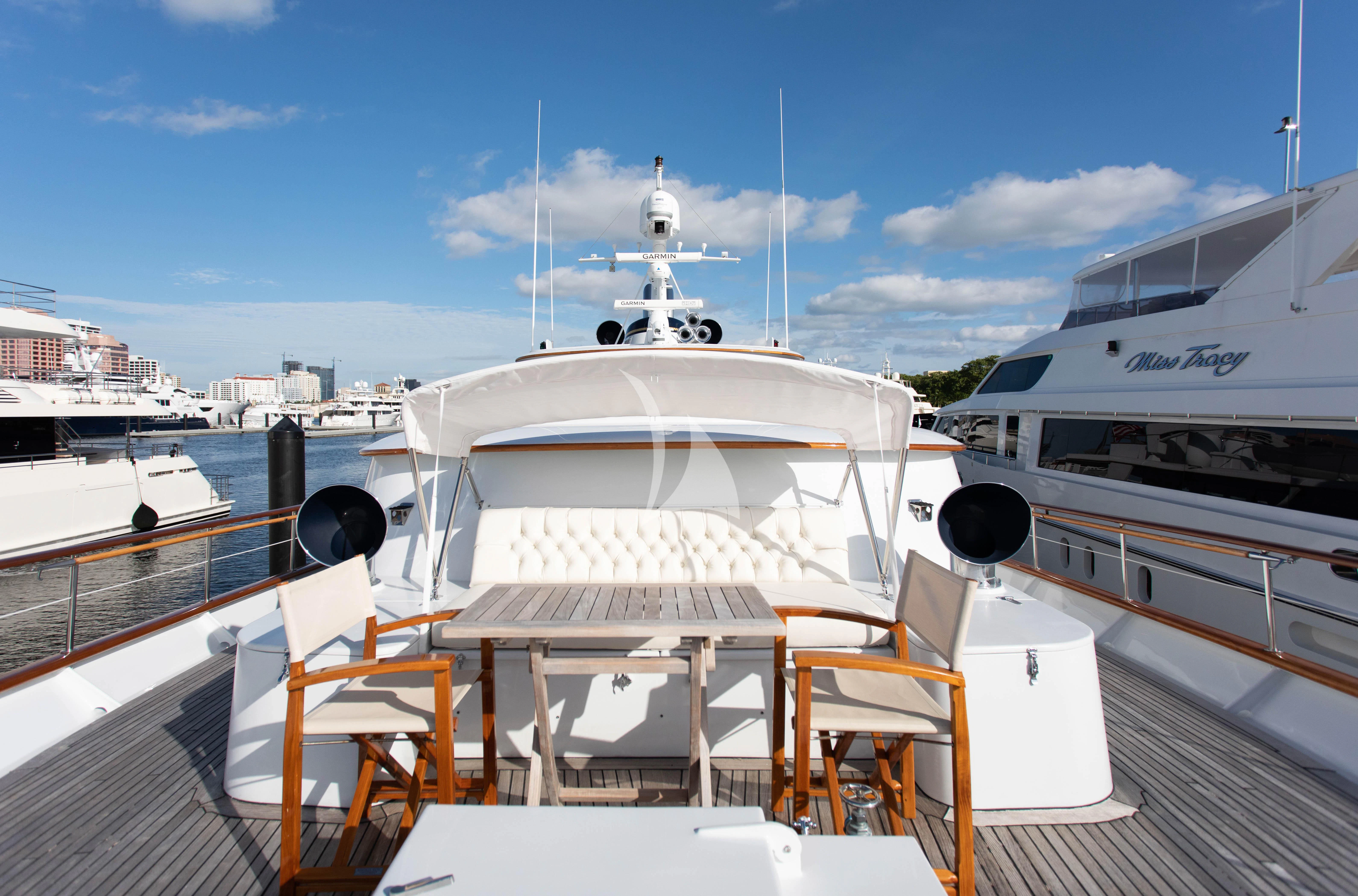 a boat docked at a pier aboard SOVEREIGN Yacht for Charter