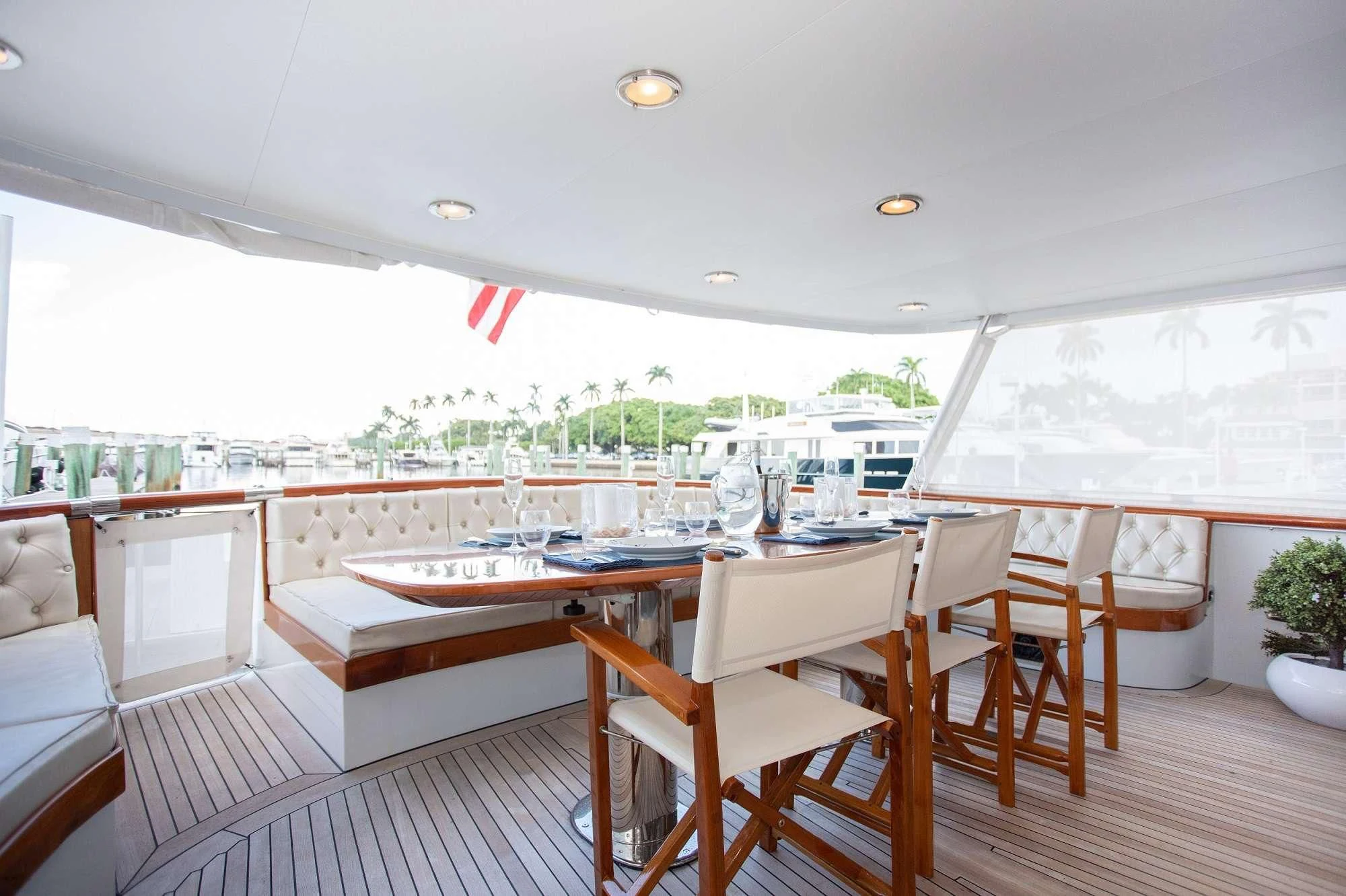a room with a table and chairs aboard SOVEREIGN Yacht for Charter