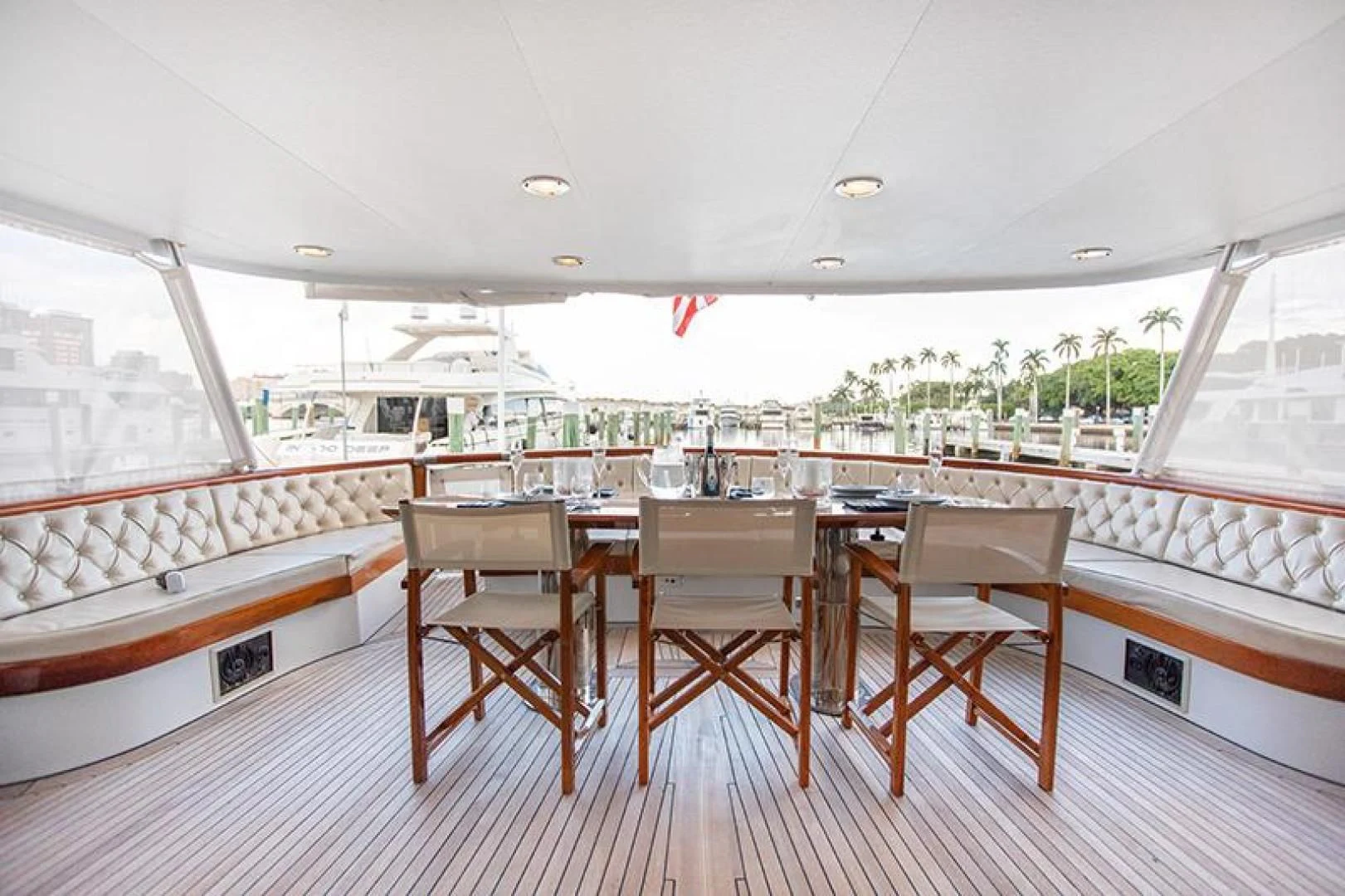 a room with a table and chairs aboard SOVEREIGN Yacht for Charter