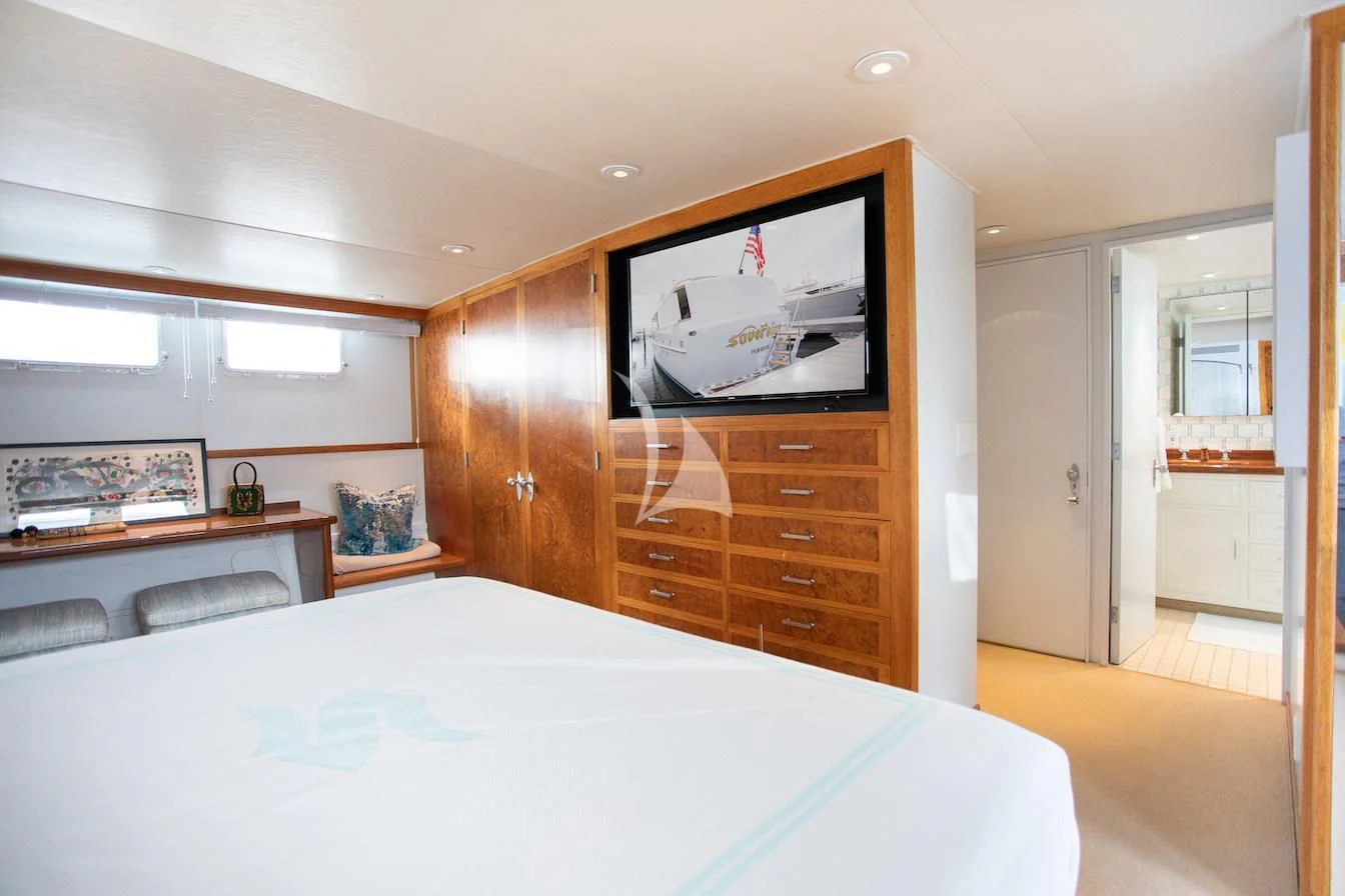 a bedroom with a large bed aboard SOVEREIGN Yacht for Charter
