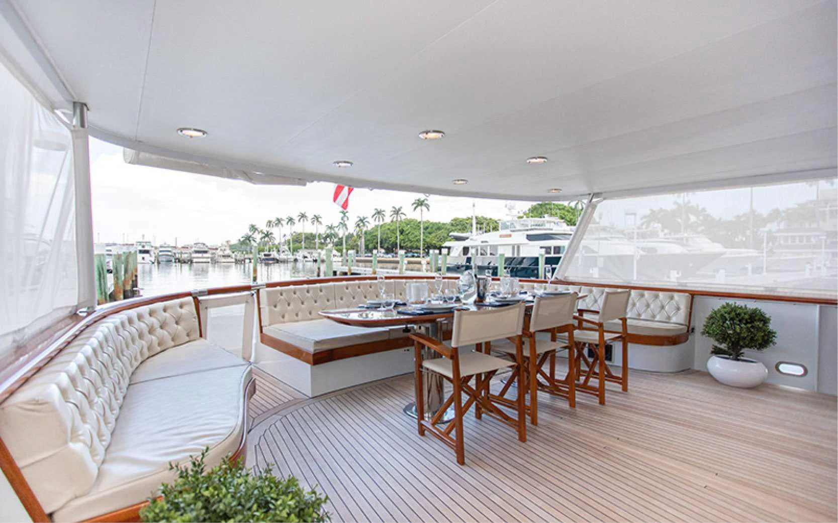 a room with a table and chairs aboard SOVEREIGN Yacht for Charter