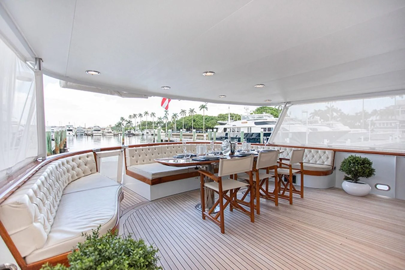 a room with a table and chairs aboard SOVEREIGN Yacht for Charter