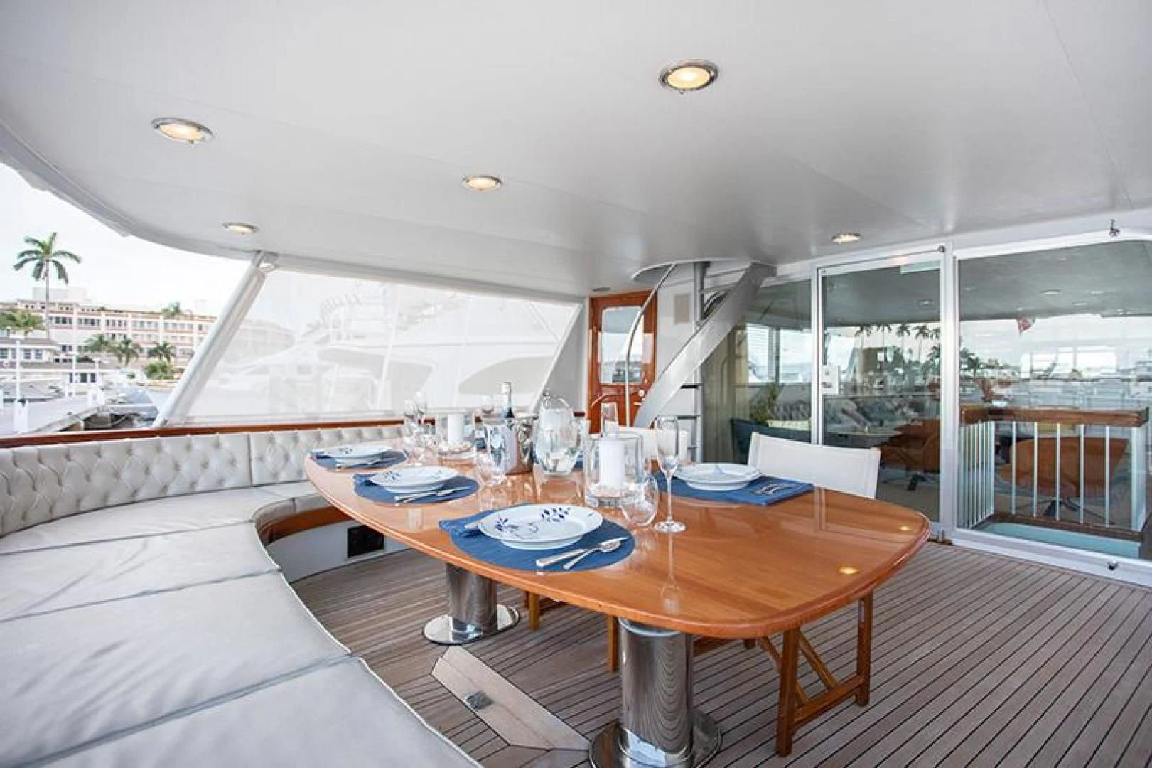 a table with plates and glasses on it aboard SOVEREIGN Yacht for Charter