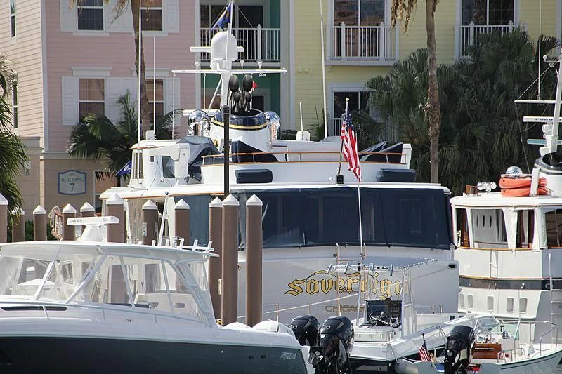 a boat docked in a harbor aboard SOVEREIGN Yacht for Charter