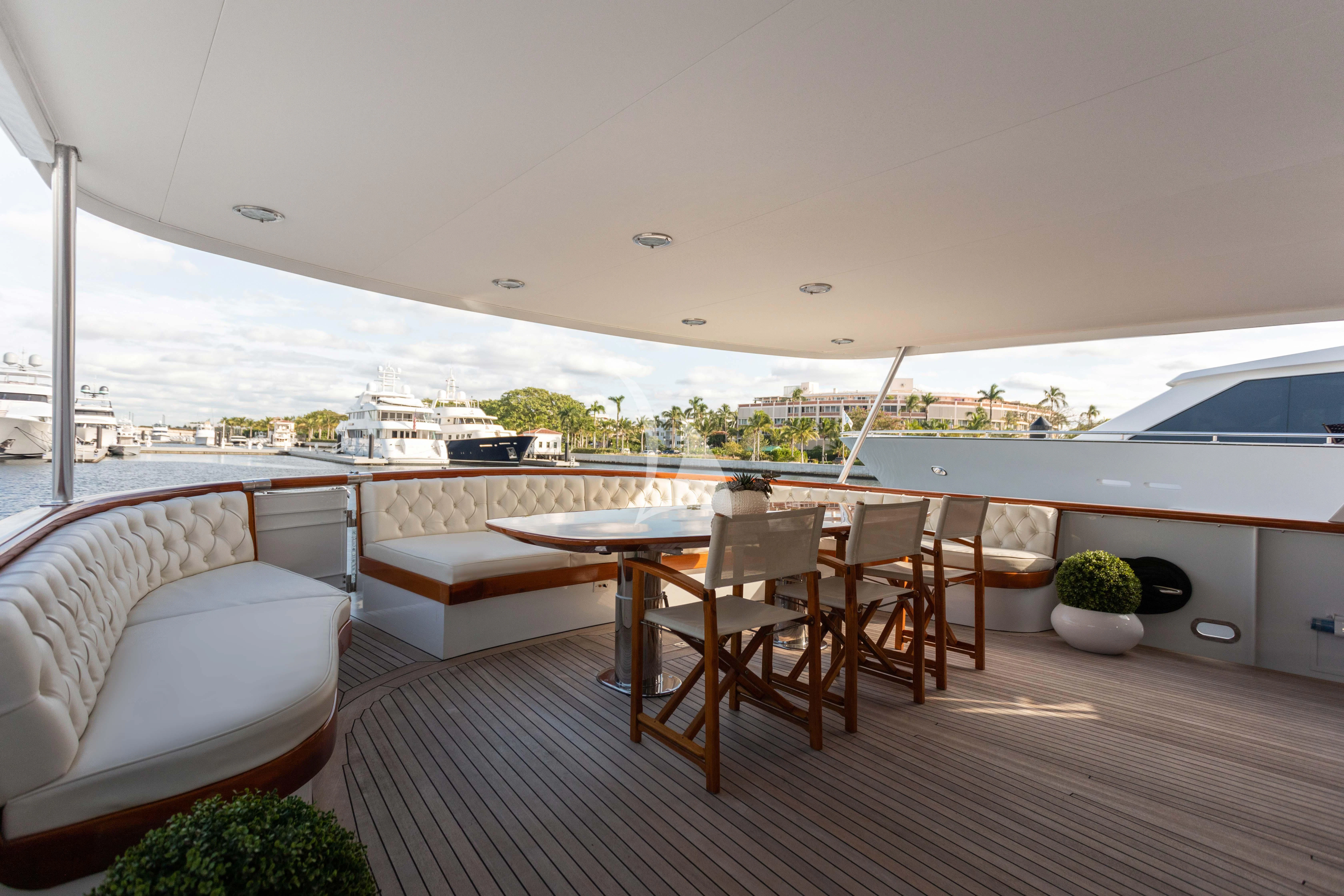 a room with a table and chairs aboard SOVEREIGN Yacht for Charter