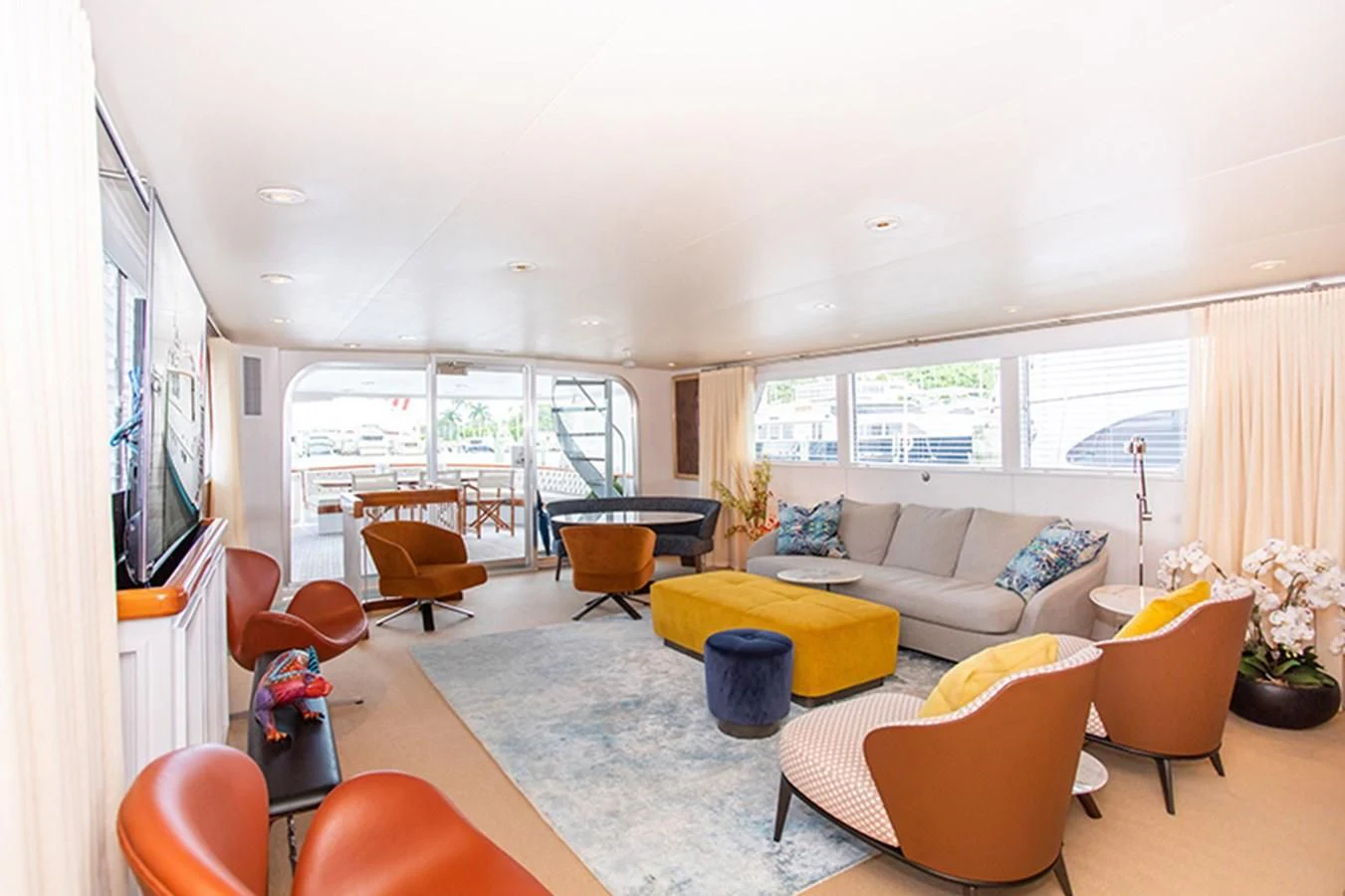 a living room with a couch and a table aboard SOVEREIGN Yacht for Charter