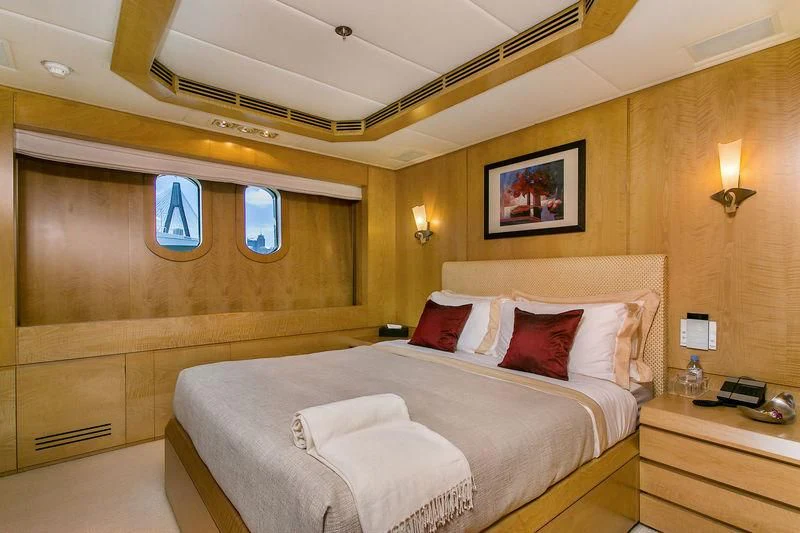 a bed in a room aboard BACA Yacht for Charter