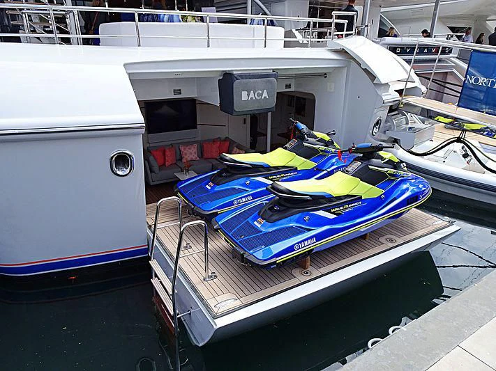 a boat with a surfboard on it aboard BACA Yacht for Charter