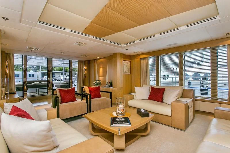 a living room with a couch and a coffee table aboard BACA Yacht for Charter