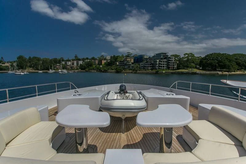 a table and chairs on a boat aboard BACA Yacht for Charter