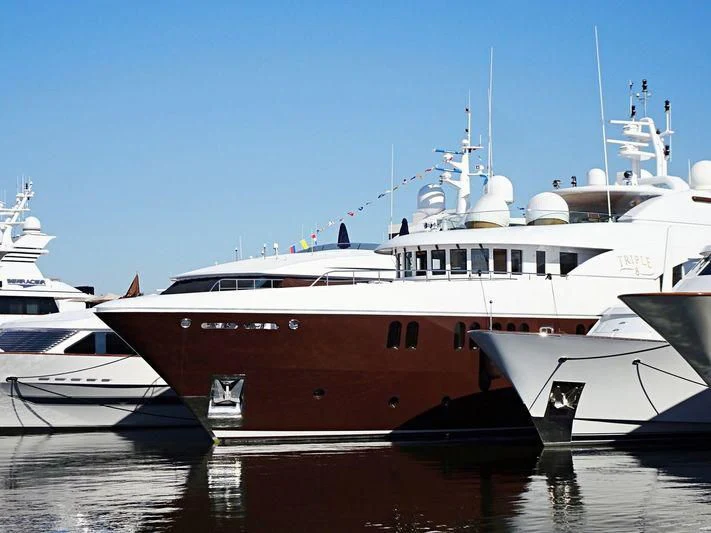 a large white boat in the water aboard BACA Yacht for Charter