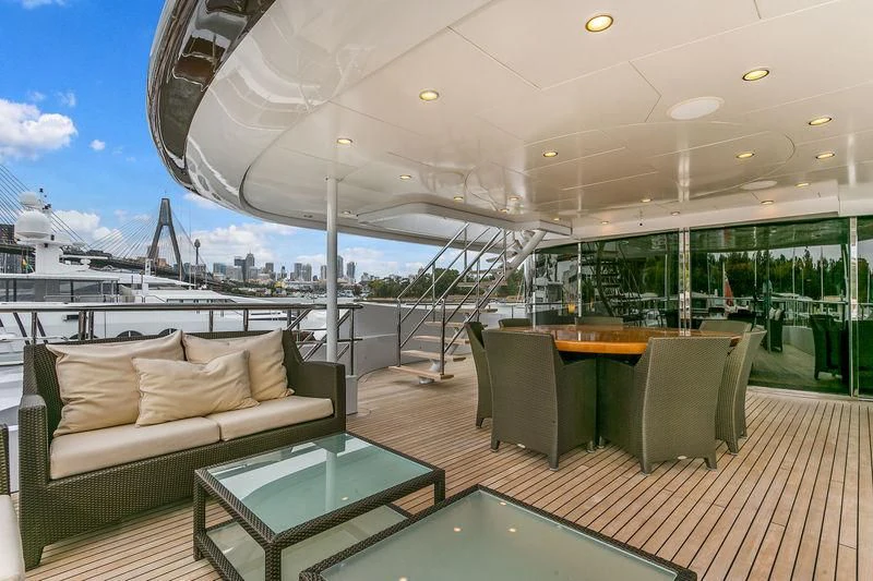 a room with a table and chairs aboard BACA Yacht for Charter