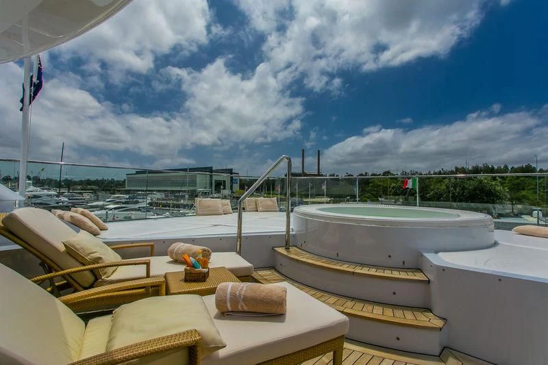 a room with a view of a city and a pool aboard BACA Yacht for Charter