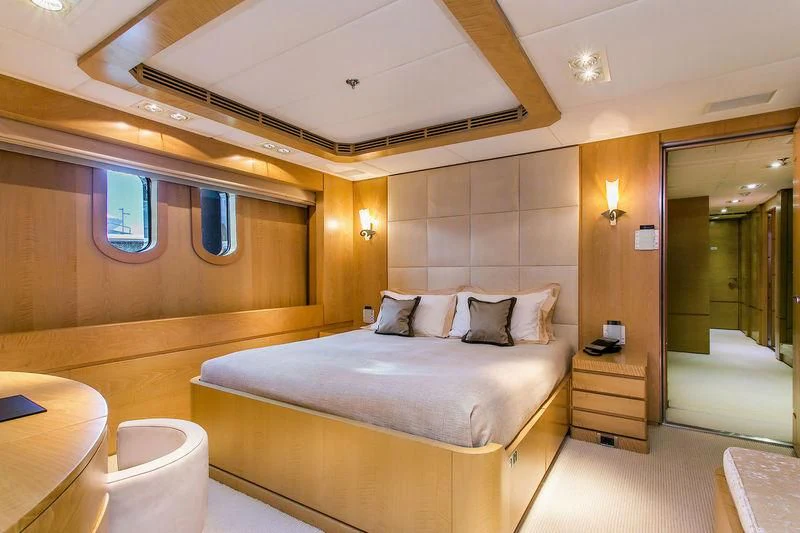 a hotel room with a bed aboard BACA Yacht for Charter