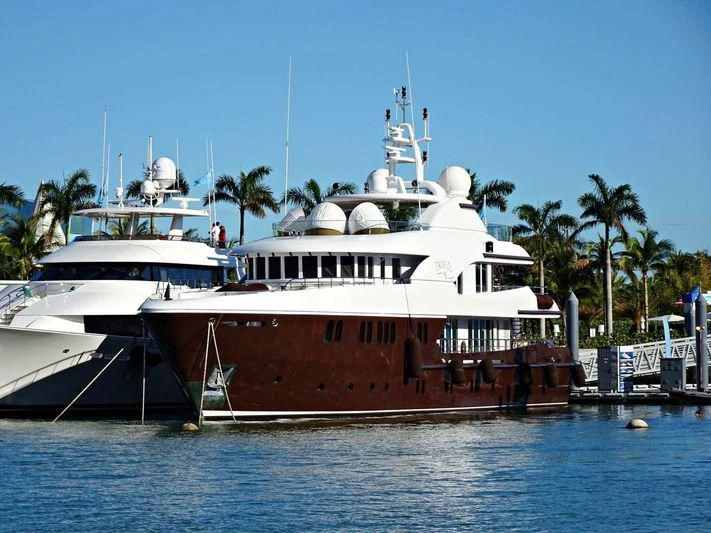 a couple of large boats in the water aboard BACA Yacht for Charter