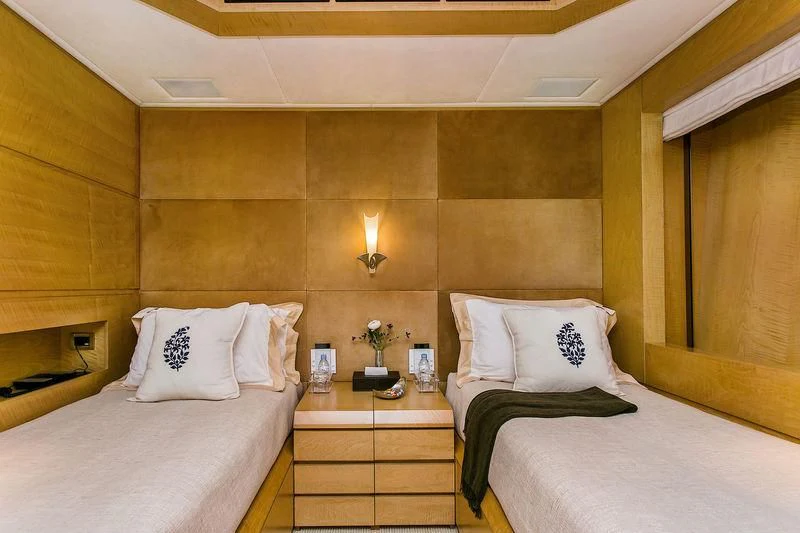 a room with two beds aboard BACA Yacht for Charter