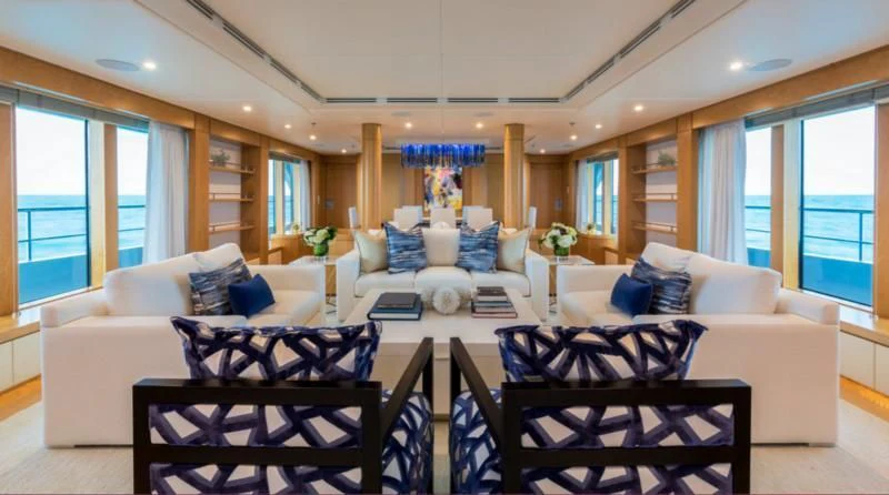 a living room with a couch and a table aboard BACA Yacht for Charter