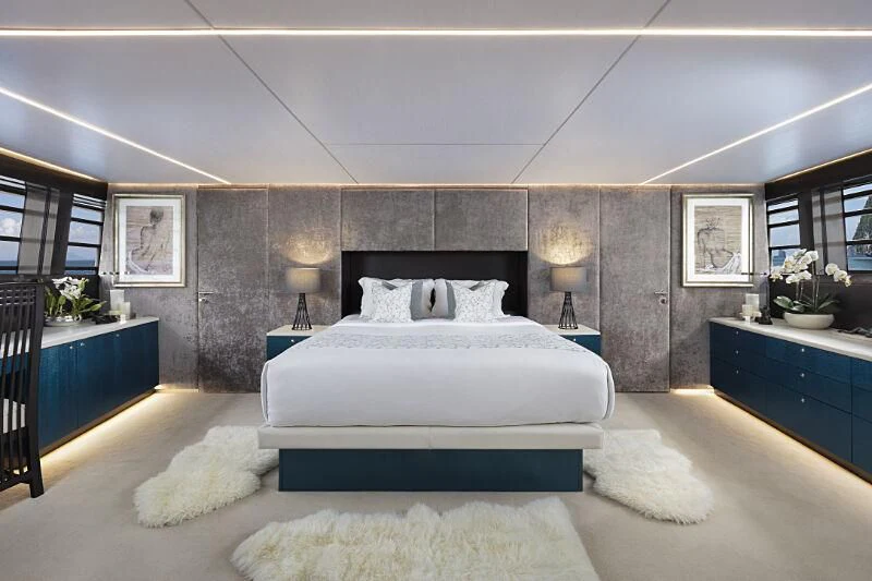 a large bedroom with a large bed aboard OCEAN EMERALD Yacht for Sale