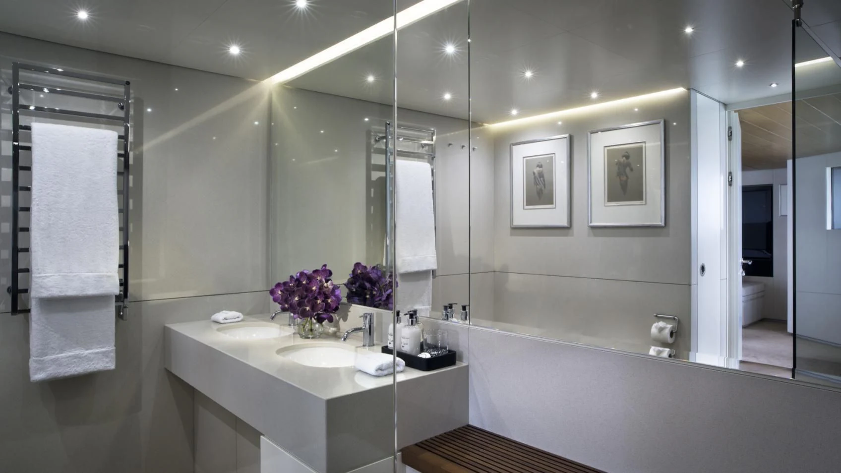 a bathroom with a large mirror aboard OCEAN EMERALD Yacht for Sale