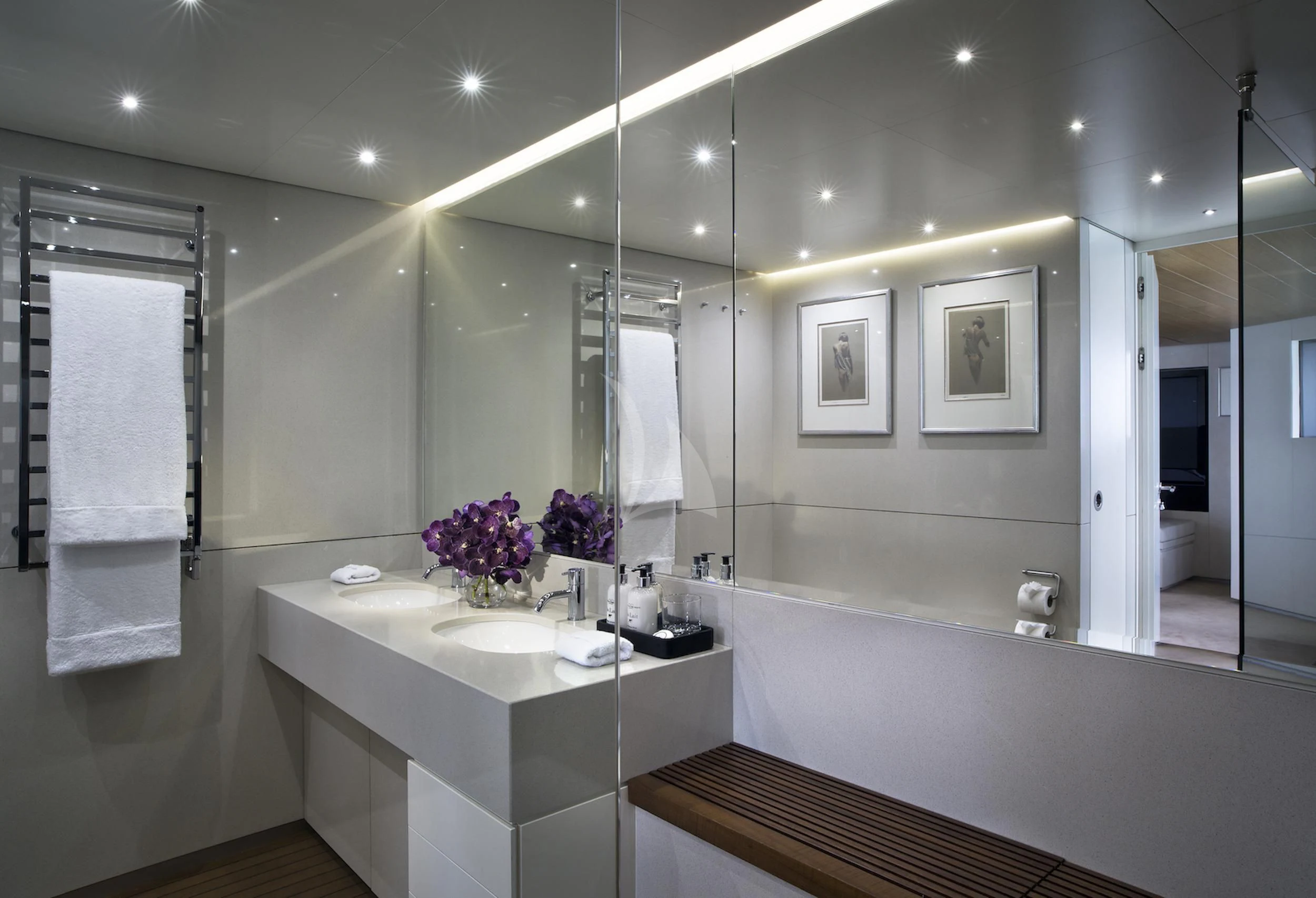 a bathroom with a tub sink and a mirror aboard OCEAN EMERALD Yacht for Sale