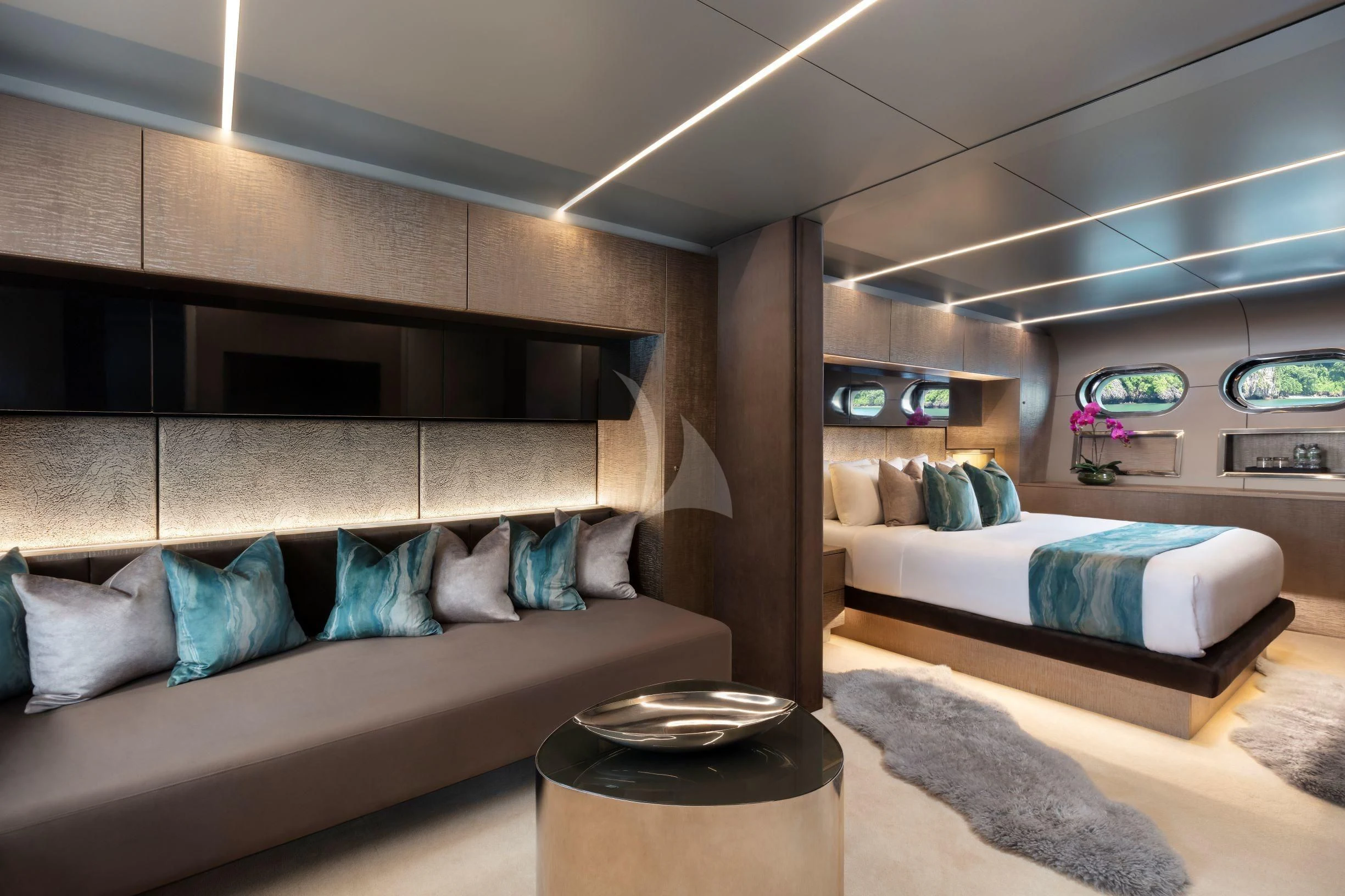 a room with a bed and a couch aboard OCEAN EMERALD Yacht for Sale