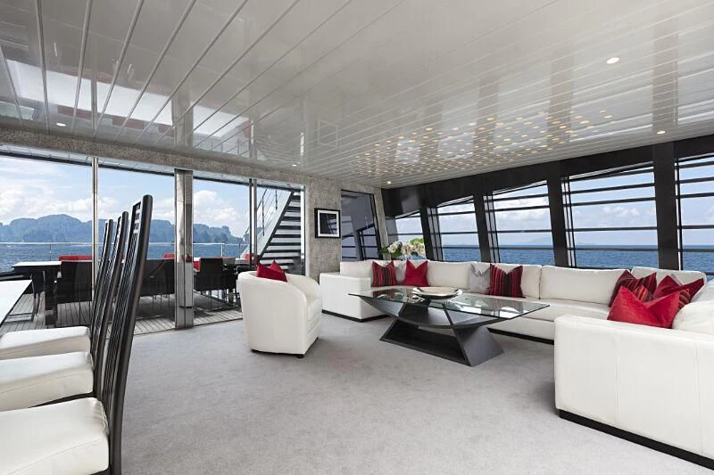a living room with a large window aboard OCEAN EMERALD Yacht for Sale