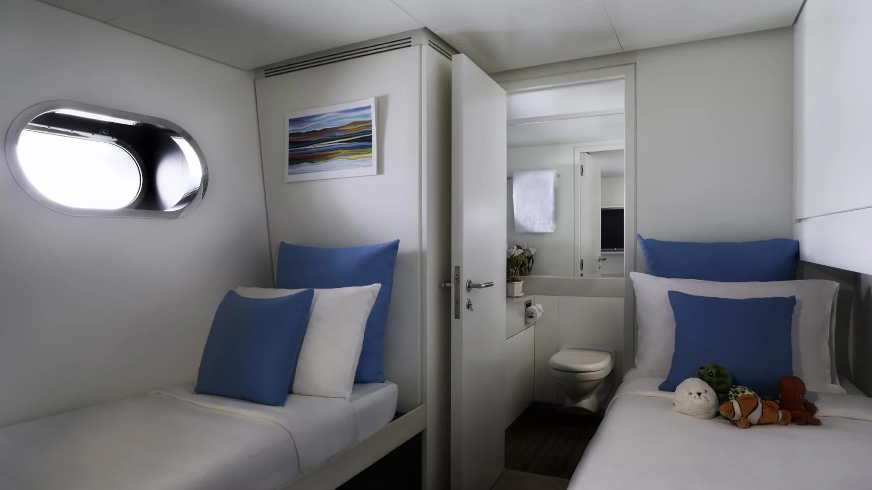 a room with a bed and a window aboard OCEAN EMERALD Yacht for Sale