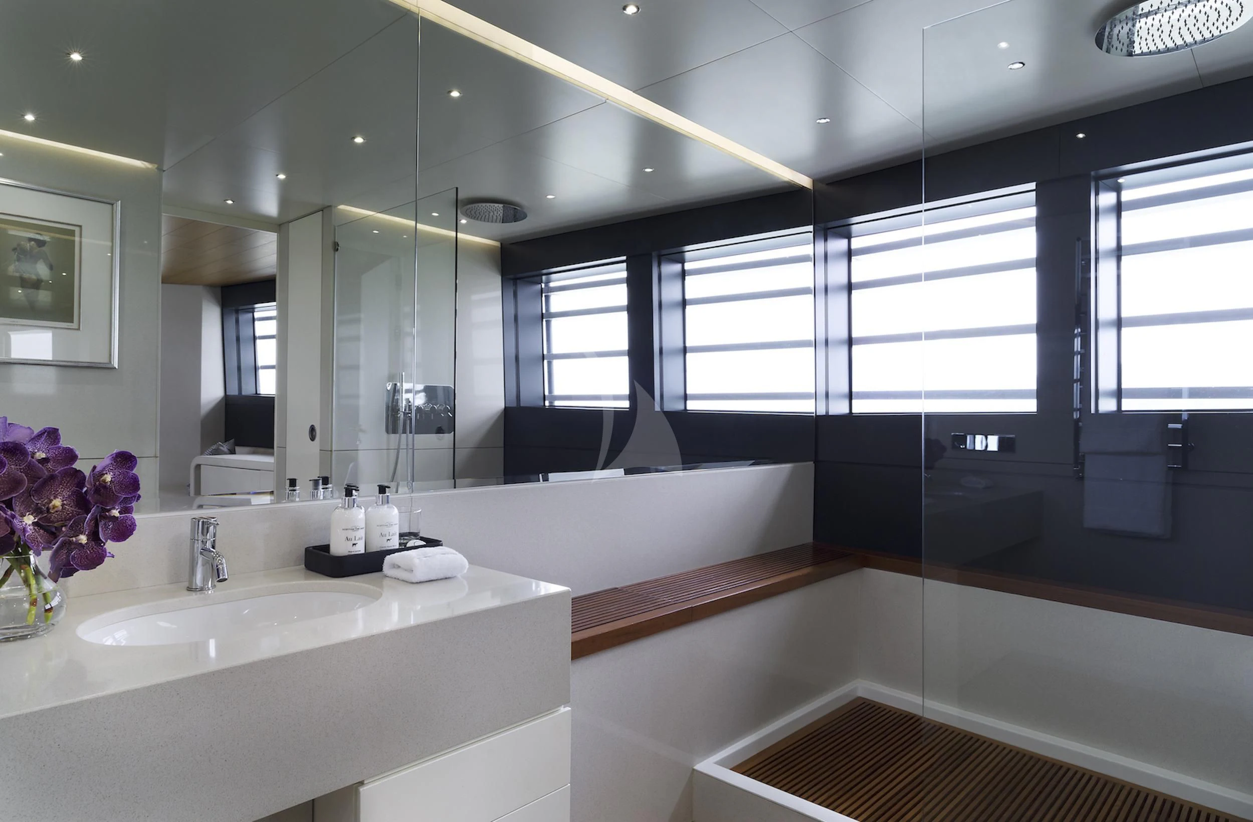 a bathroom with a large mirror aboard OCEAN EMERALD Yacht for Sale