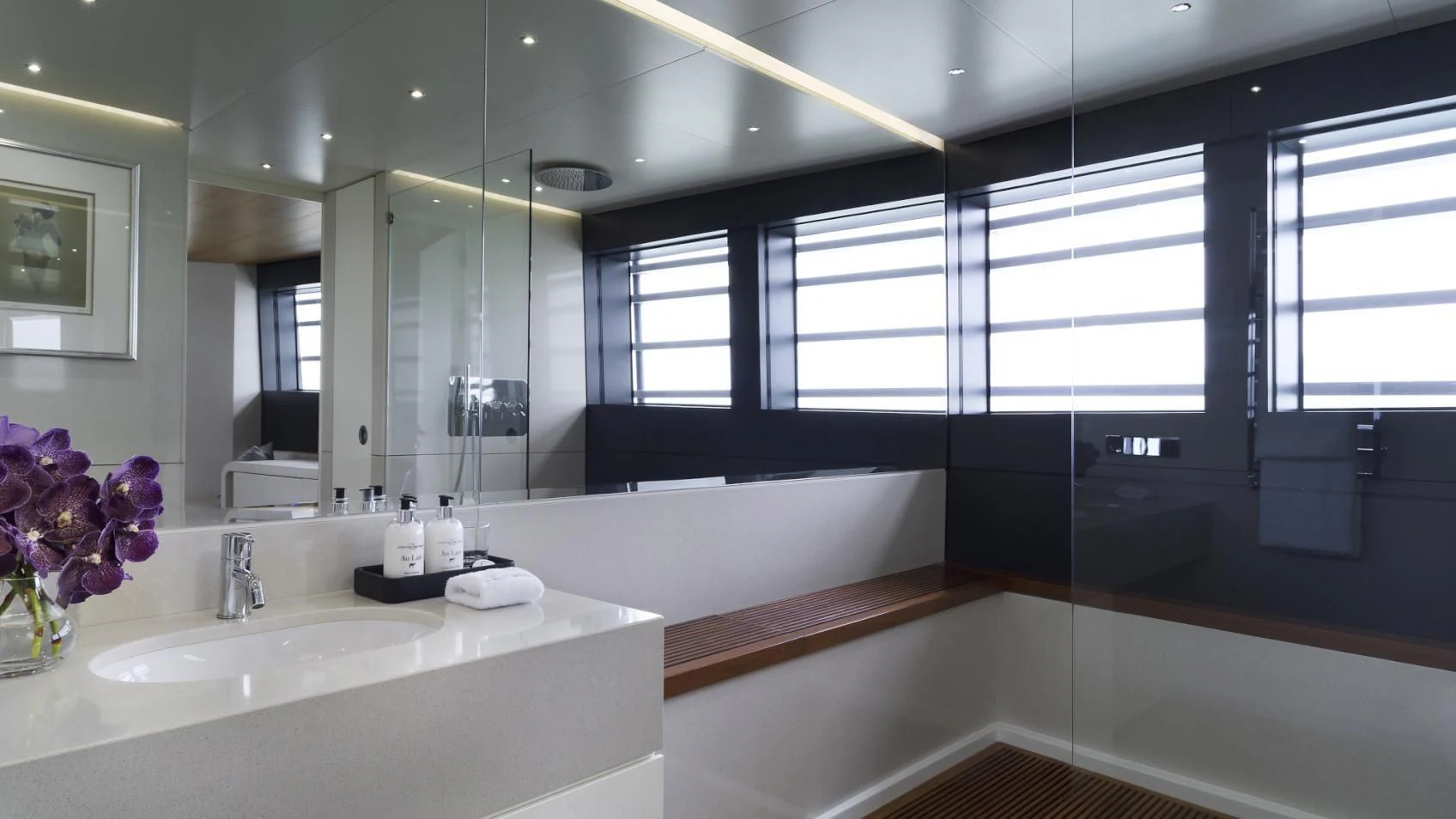 a bathroom with a large mirror aboard OCEAN EMERALD Yacht for Sale