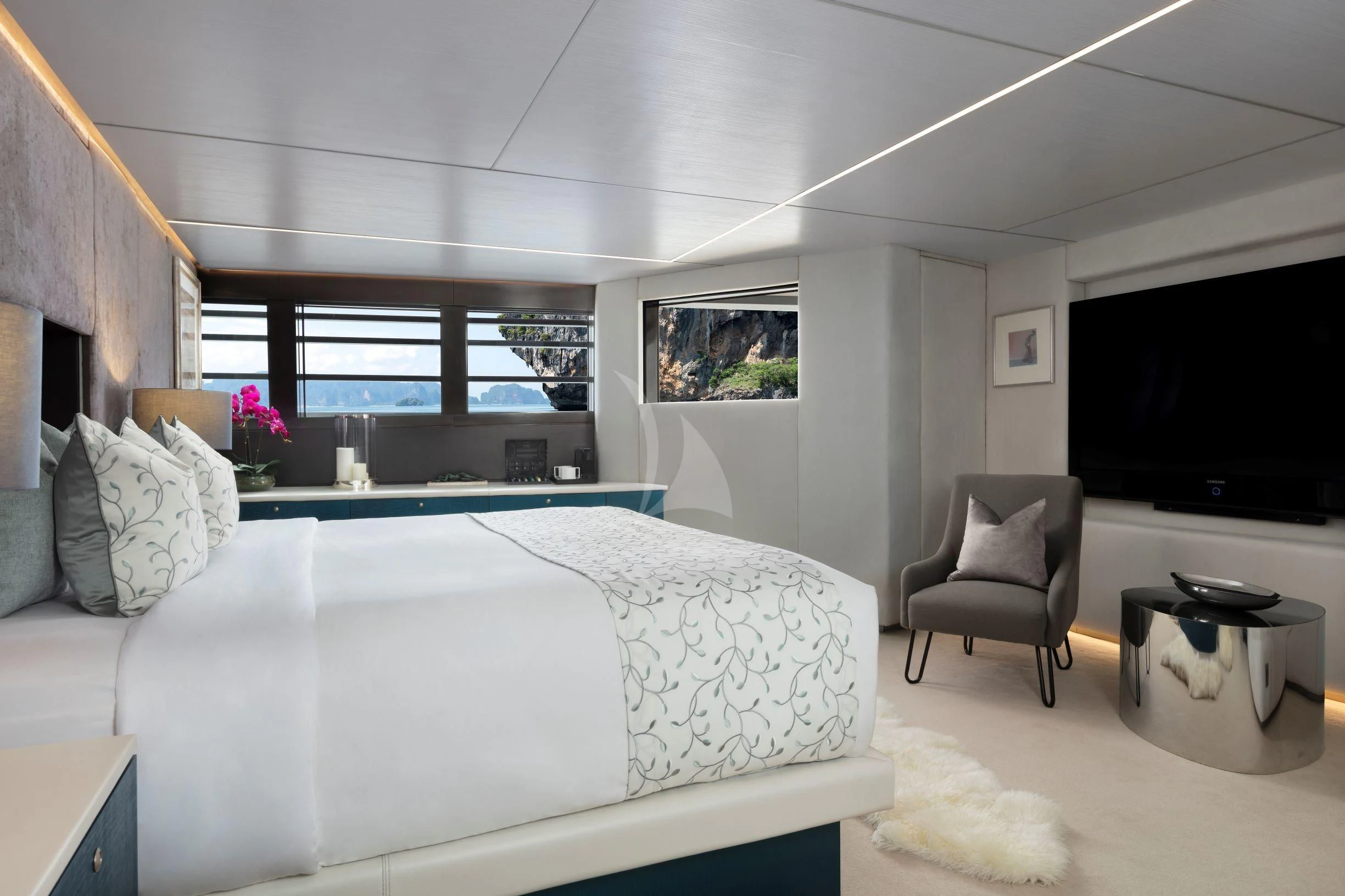 a bedroom with a bed and a tv aboard OCEAN EMERALD Yacht for Sale