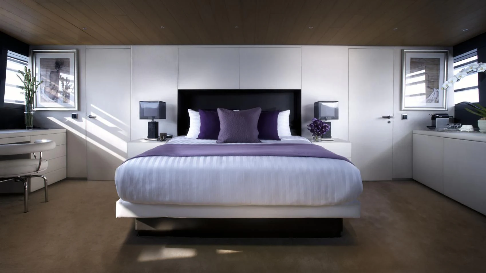 a large bed in a room aboard OCEAN EMERALD Yacht for Sale