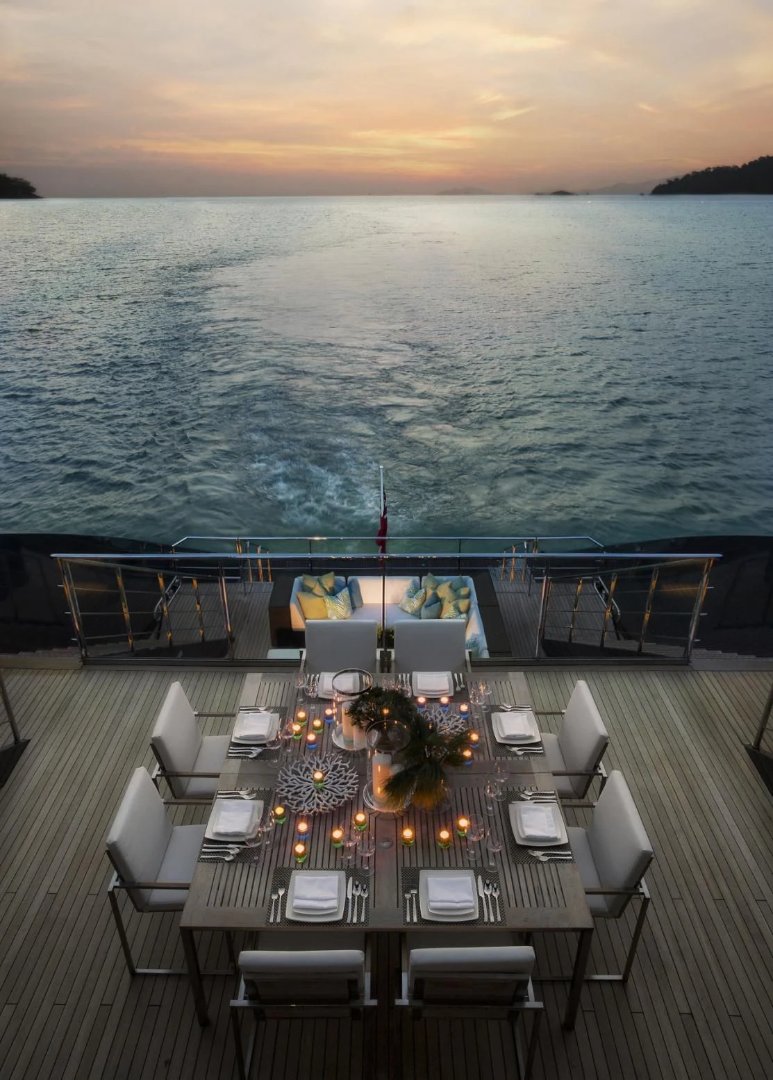 a table set for a dinner party aboard OCEAN EMERALD Yacht for Sale