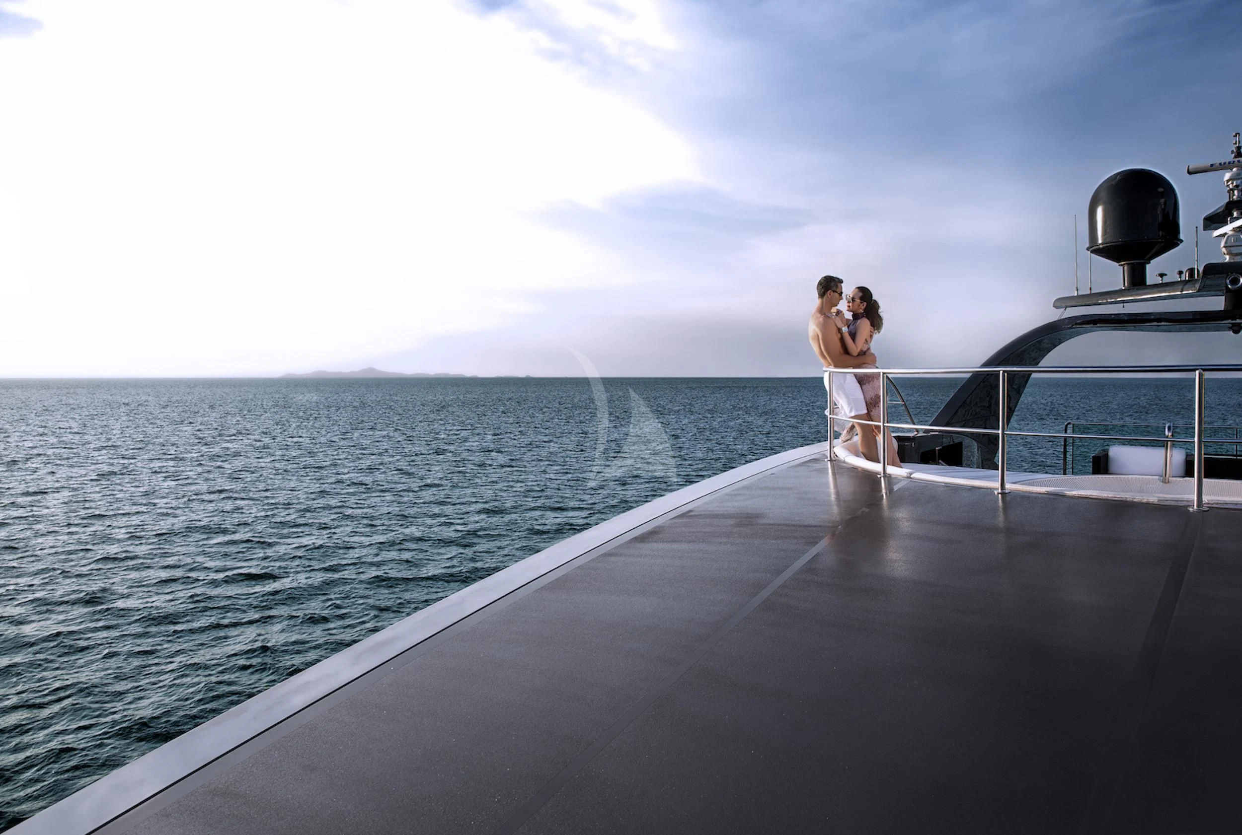 a couple kissing on a boat aboard OCEAN EMERALD Yacht for Sale