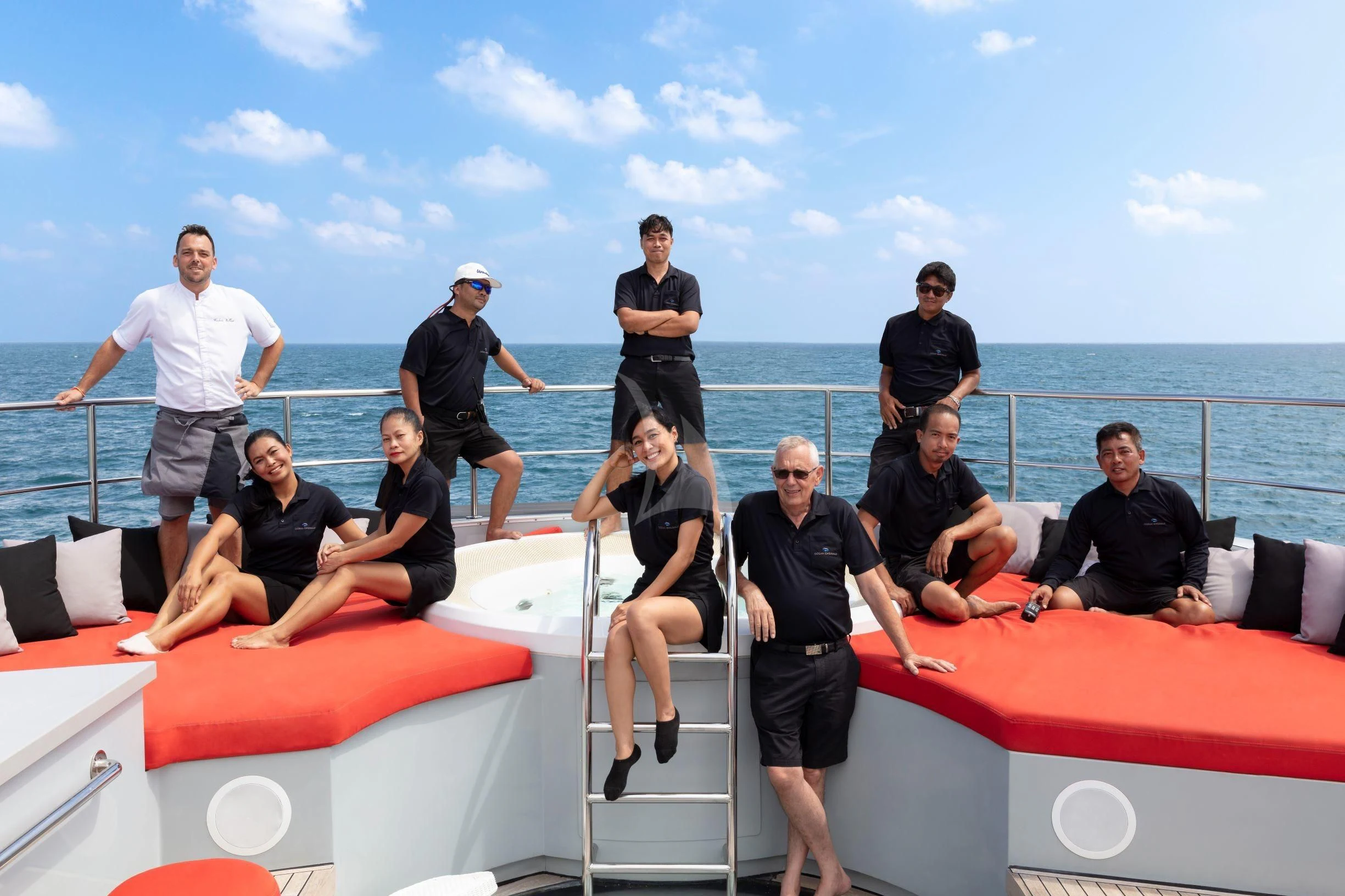a group of people on a boat aboard OCEAN EMERALD Yacht for Sale
