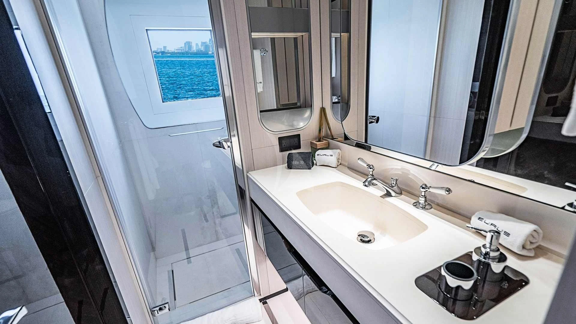 a bathroom with a sink and a mirror aboard BELLA VITA Yacht for Charter
