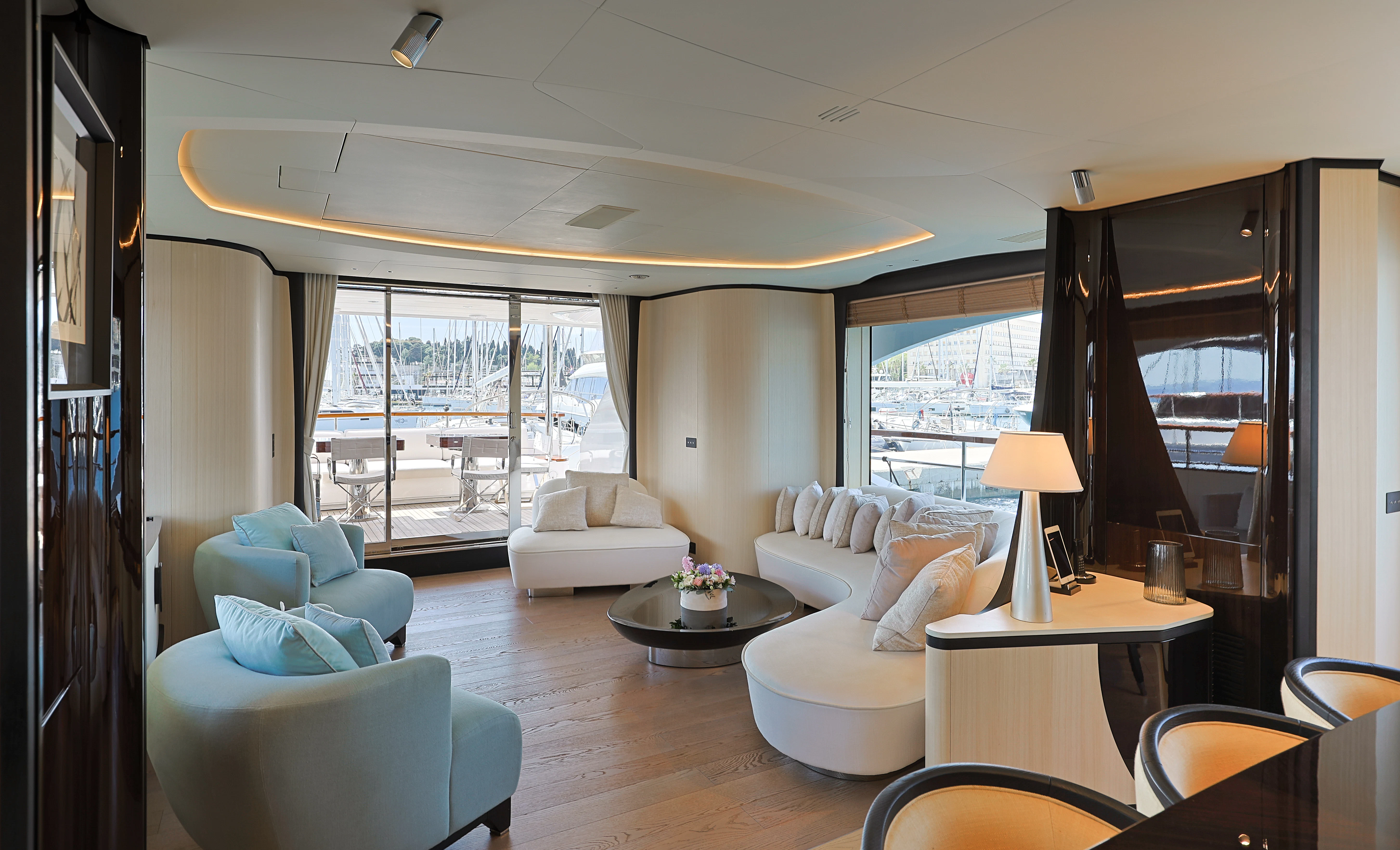 a living room with a large window aboard BELLA VITA Yacht for Charter