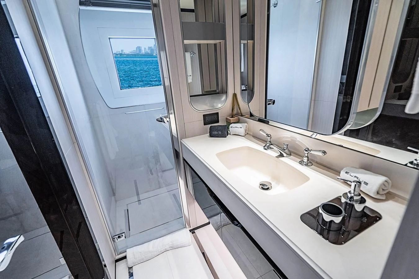 a bathroom with a sink and a mirror aboard BELLA VITA Yacht for Charter