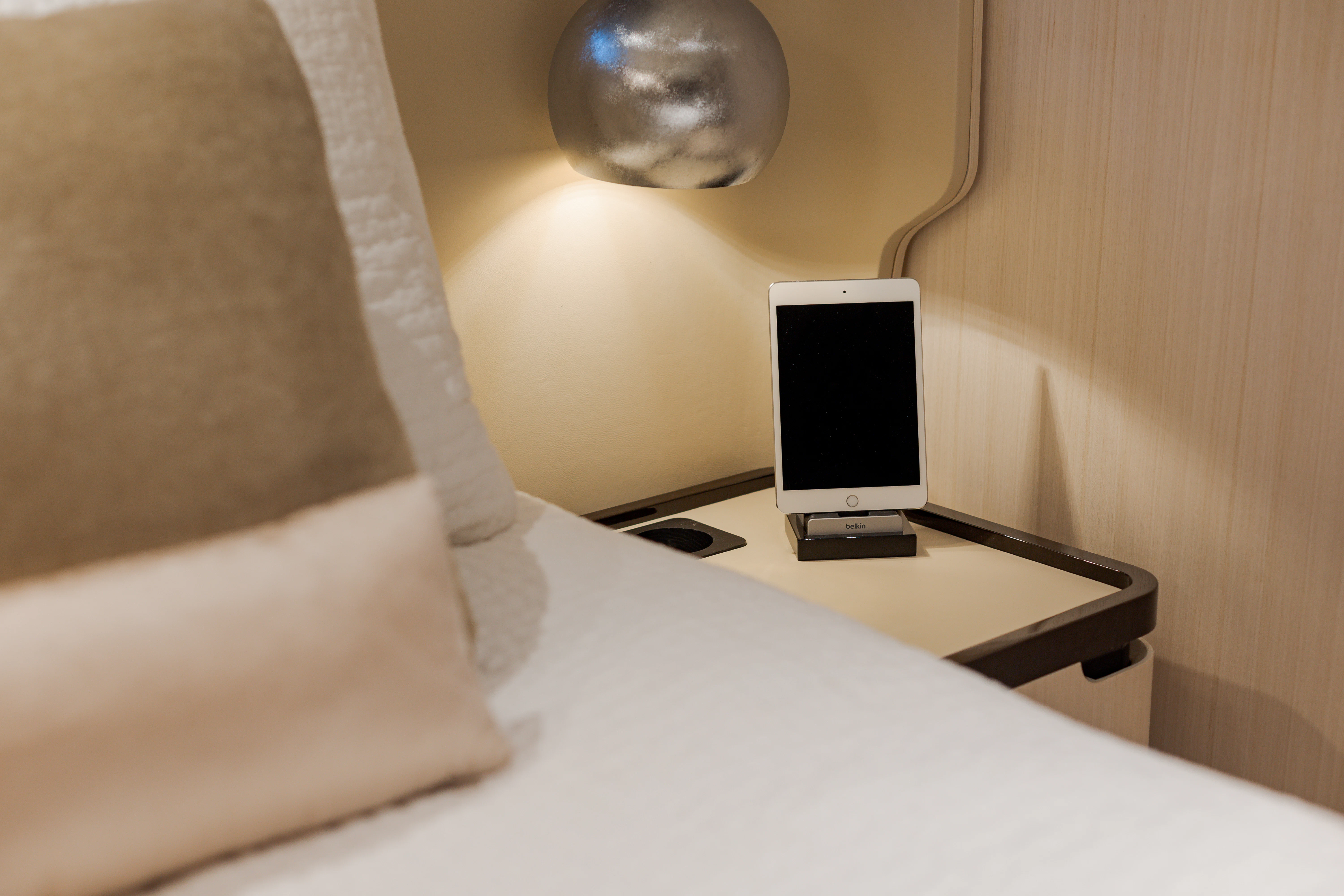 a bed with a computer on it aboard BELLA VITA Yacht for Charter