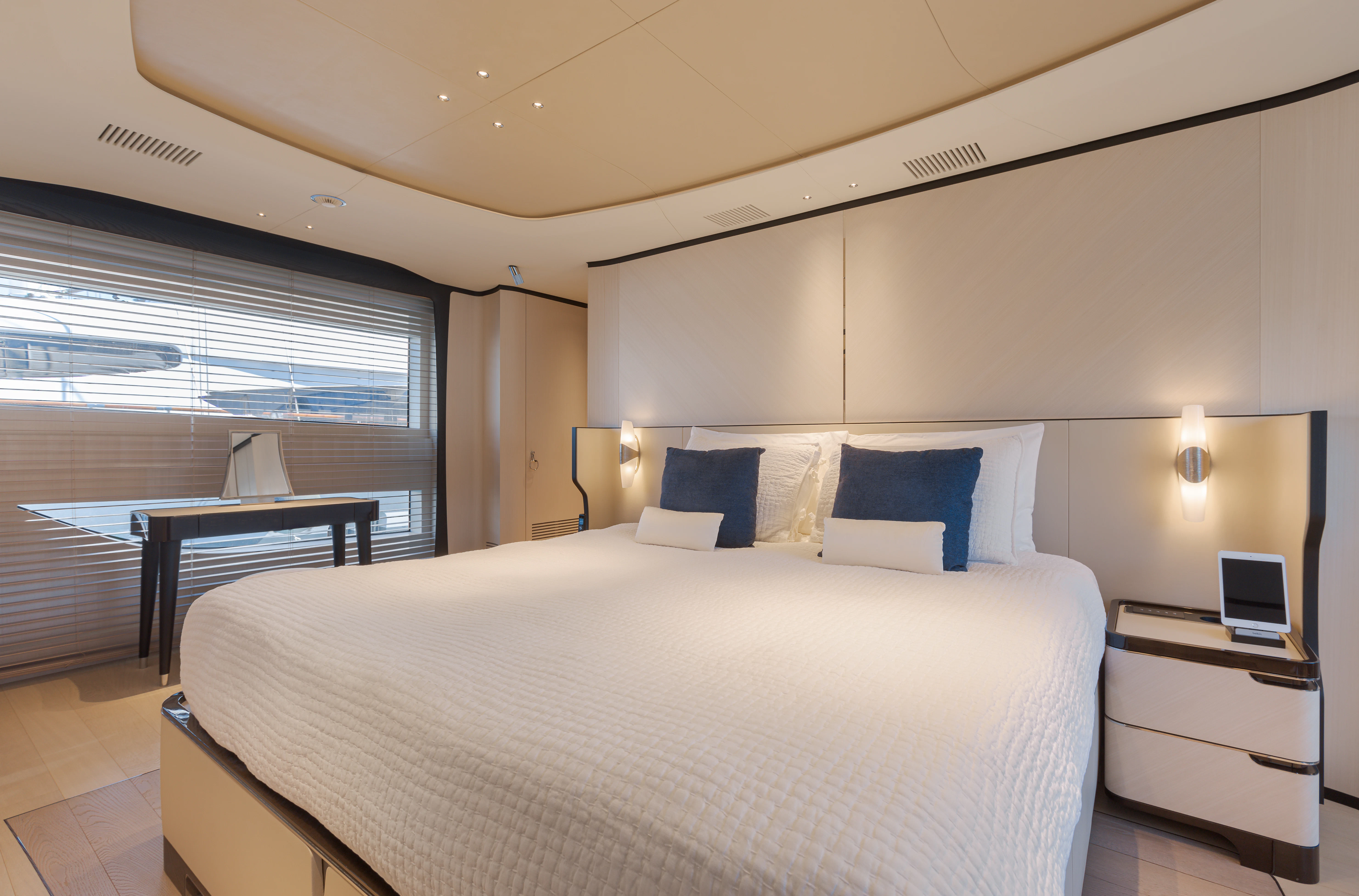 a bed with a white sheet and a white bed spread aboard BELLA VITA Yacht for Charter