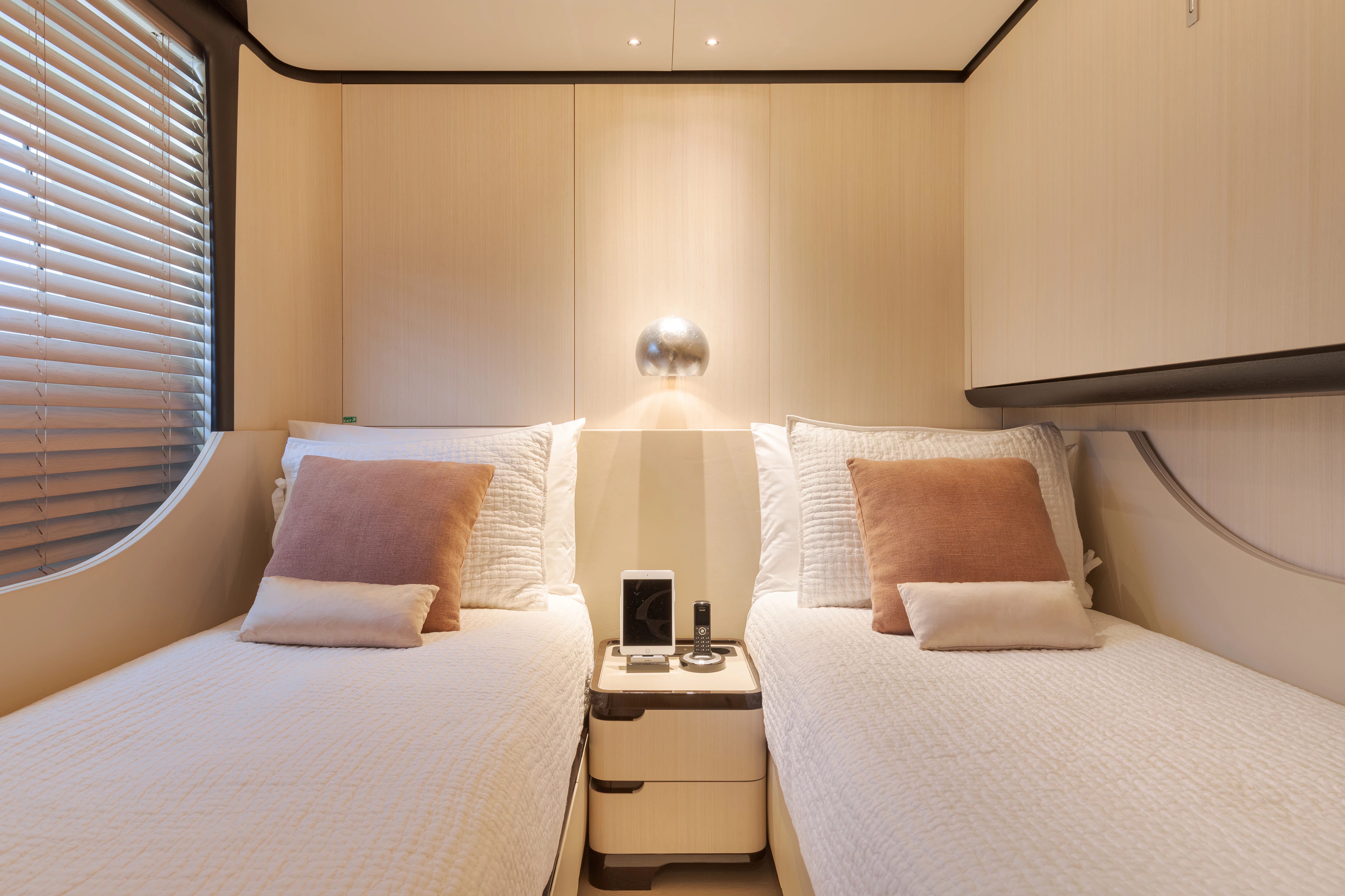 a couple of beds in a hotel room aboard BELLA VITA Yacht for Charter