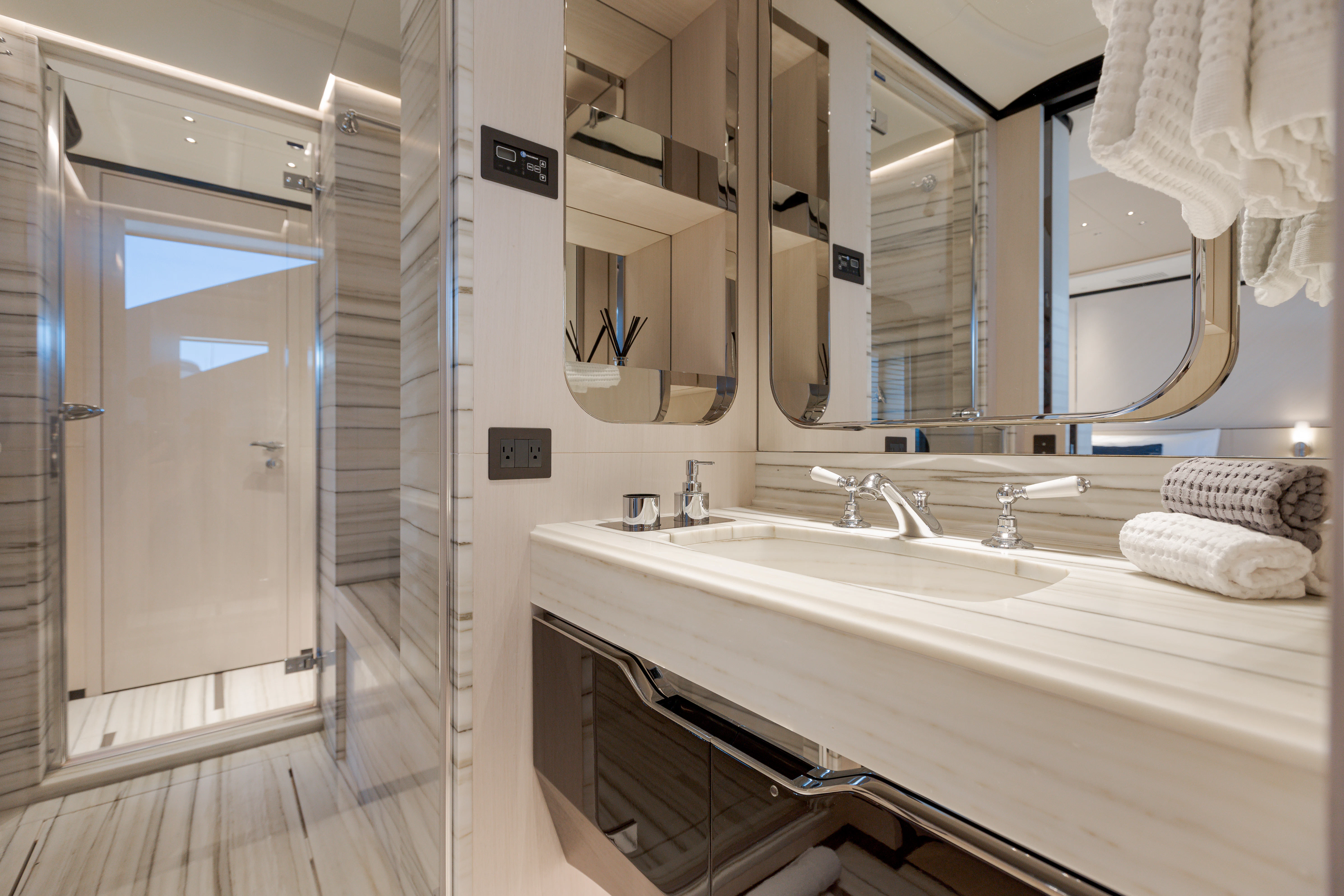 a bathroom with a large mirror aboard BELLA VITA Yacht for Charter