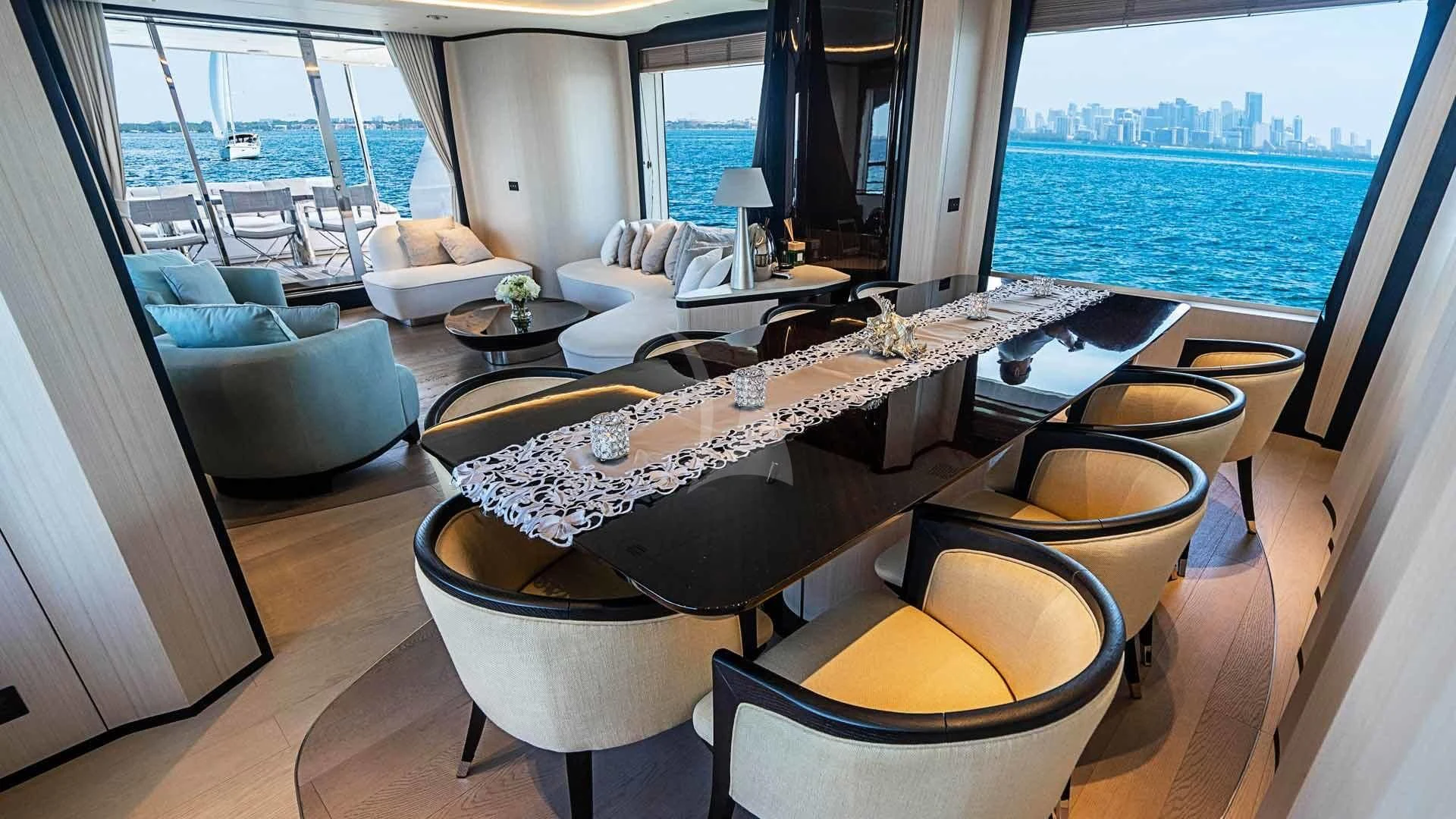 a room with a couch and a table and chairs aboard BELLA VITA Yacht for Charter